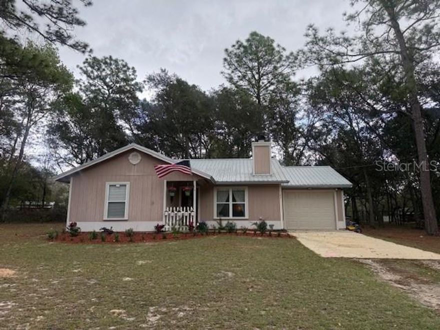 Perfect starter home located just off Immokalee Road in Clay County! Situated on a private 1-acre lot at the end of a quiet cul-de-sac, this property offers peaceful surroundings with plenty of room to enjoy the outdoors. Inside, the living room features beautiful wood floors, soaring cathedral ceilings, and a cozy wood-burning fireplace that creates a warm and inviting space for relaxing or entertaining. The home also includes a one-car garage with a new garage door and opener. Several important updates have already been completed, including a new water heater and dishwasher in 2025, a roof replaced in December 2020, and an AC/heat pump installed in 2019. With its private setting, thoughtful updates, and comfortable layout, this home is a great opportunity for first-time buyers or anyone looking for quiet country living with convenient access to town.