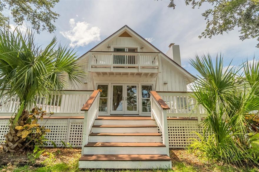 Welcome Home to your slice of "Old Florida" paradise nestled within the embrace of nature's beauty. This enchanting property boasts just under a half-acre lot adorned with majestic live oak trees, their graceful limbs adorned with Spanish moss, creating an atmosphere of timeless charm. This two-story board and batten chalet-style home, lovingly built in 1975, is a testament to classic design and craftsmanship.

Situated on the tranquil waterside, this home is a haven for those who appreciate the finer things in life. As you step onto the property, you'll be captivated by the sprawling 257 feet of water frontage that envelops the estate. The property uniquely graces two sides of water - a serene canal on one and a picturesque cove on the other, which offers access to the intracoastal waterway.

Imagine your mornings, waking up to the soft hues of dawn reflecting off the water, sipping your coffee on the expansive 700+ sq foot deck, as tarpon gracefully break the surface and dolphins catch their first meal of the day. Nature's spectacle is your daily companion.

For those who enjoy hosting parties, the separate smoke house is your gateway to the most amazing cookouts, while the detached inground pool, embraced by a protective screen enclosure, offers a cool respite on warm summer days. A small private boat ramp ensures your aquatic adventures are at your doorstep, while the corrugated seawall on the cove side and natural shoreline on the canal side safeguard the property.

A small dock awaits fishing enthusiasts or kayakers, promising hours of enjoyment on the water. This space is yours to customize and tailor to your desires.

As you step inside, you will be welcomed by a modestly remodeled home, allowing the natural light to flood every corner. The layout features one bedroom downstairs, providing both privacy and convenience, while two additional bedrooms grace the upper floor. One of these bedrooms offers a private balcony overlooking the tranquil cove, with peeks of the river beyond.

This home resides on a peaceful dead-end street, ensuring your retreat remains a sanctuary of calm. This home invites you to create a lifestyle where every day is a celebration of the exquisite natural surroundings and the timeless allure of "Old Florida."

Indulge in the magic of waterfront living, and seize the opportunity to make this enchanting property your forever home. If you are going to live where everyone else vacations, you might as well live like you are on vacation! Schedule a showing today and step into a world where charm, serenity, and the allure of the water converge in perfect harmony. ;Water: City