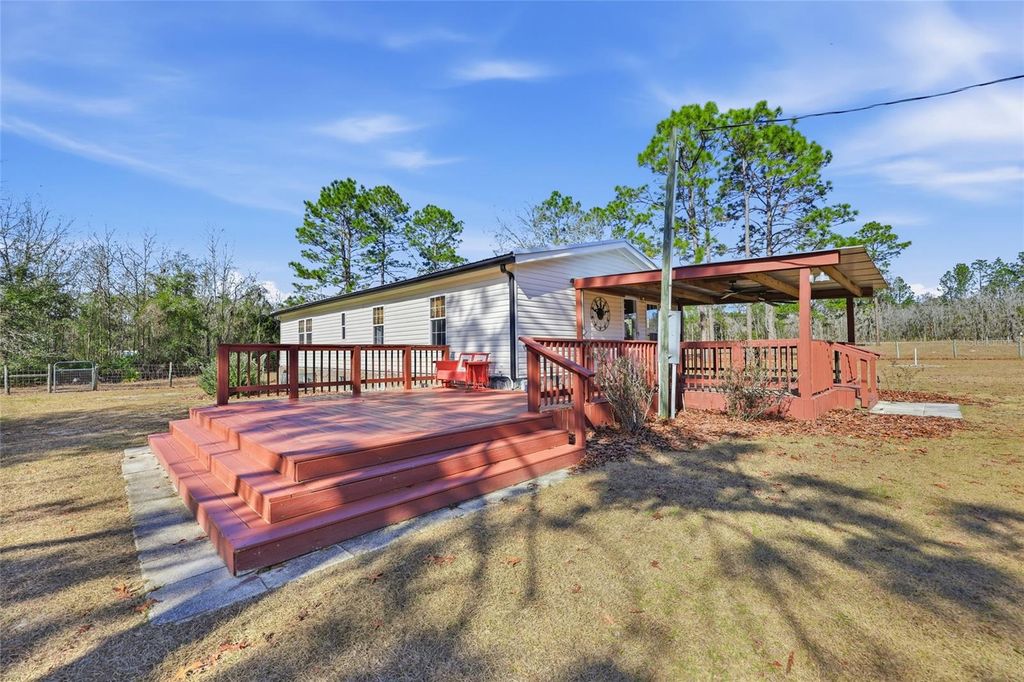 Photo of 7119 NE 24th Loop, High Springs, FL 32643 (MLS # GC536848)