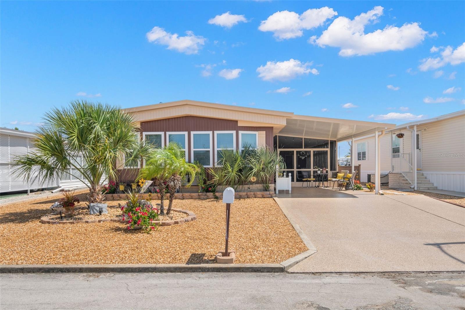 Immaculate, Turn-Key 3 Bedroom 2 Bath Home with Recent High-End Upgrades. Welcome to 7402 Grand Pine Drive, a beautifully refreshed and reimagined 1,224 sq. ft. manufactured home in sought-after Ponderosa Park in Pasco County. This home has been meticulously updated inside and out. Check out these Key Features & Upgrades: New paint inside and out, landscaped lot with fresh curb appeal, reconfigured floorplan to create a third bedroom, luxury touches with vanities and kitchen countertop refinished with decorative flakes, upgraded master bath: upgraded shower and toilet, a master bedroom accent pallet wall, new subfloor ensuring structural integrity, new ductwork and vapor barrier for better air quality and efficiency, windows and doors replaced for improved insulation and appearance. Unit features a new water heater (2021), a BRAND NEW AC unit just installed (2025), and new plumbing throughout in addition to a new carport installed last year. It is set in a quiet neighborhood with access to clubhouse, pool, recreation, and shuffleboard, and just minutes to shopping, medical facilities, and US-19. A smart blend of quality craftsmanship and modern styling — this home is truly move-in ready. This home features neutral colors to easily make it your own style. Don’t miss your chance to own this stunning three-bedroom gem in Ponderosa Park!