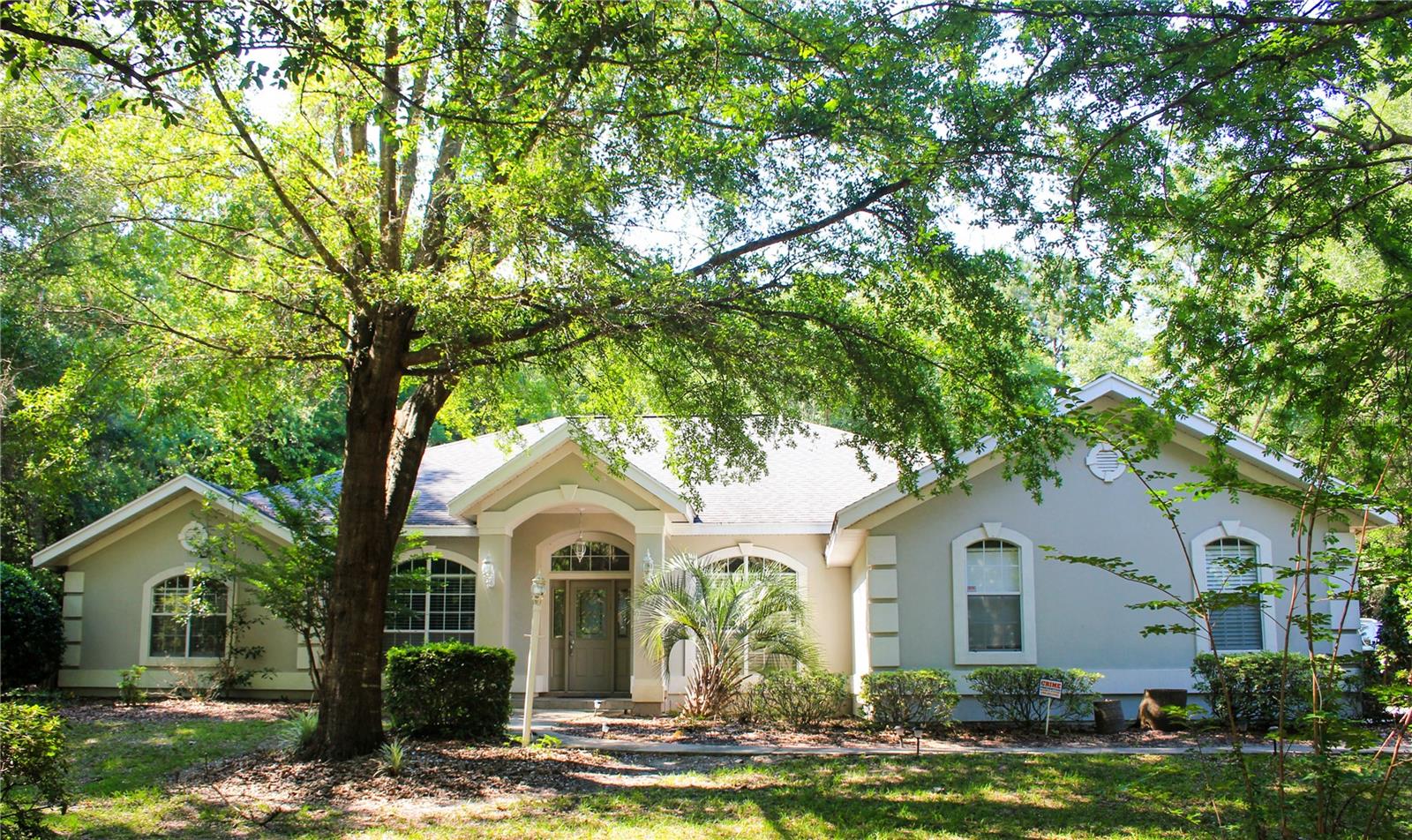 Custome built pool home beautifully landscaped on over an acre. Conveniently located in Jockey Club subdivision. This 4-bedroom 3 bath home has a grand entry, study and formal dining room. Includes washer and dryer, laundry sink and built-in ironing board. Master suite is spacious with luxurious with a bay window, trey ceilings, French doors leading out to fully screened, heated pool. Wooded lot with a great back yard. Three car garage and storage shed for maximum storage and utility.