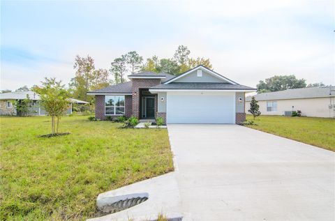 Photo of 16 Pine Crest Lane, Palm Coast, FL 32164 (MLS # FC312896)