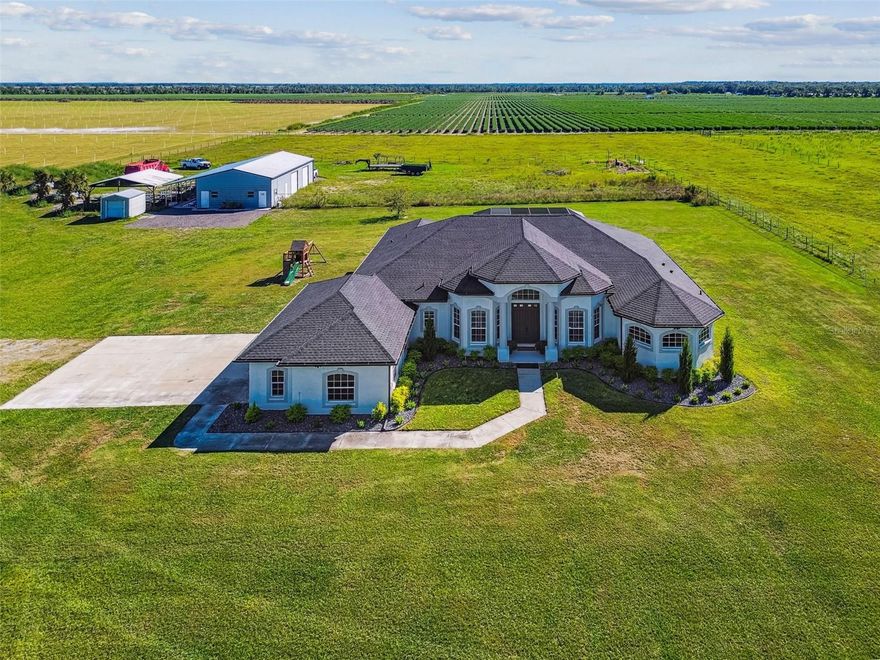 One or more photo(s) has been virtually staged. This is the one you've been waiting for. Beautiful BLOCK home with a luxury, HEATED resort style POOL, and HUGE 30x60 workshop. NO HOAs, NO CDDs, no hassles and 12.55 ACRES. 
Luxury in the country. All the nice touches you would expect AND the privacy you crave. PAVED DRIVEWAY, fully fenced, GATED with KEYPAD and greenbelted for lower taxes. Run your business with plenty of room to store just about everything and a GENERAC to guarantee power when you need it.

The house is designed to please, spacious and airy, with luxury finishes everywhere. 
The oversized GREAT ROOM can accommodate any size furniture and tv combo. Overlooking the RESORT POOL, you will love the solitude and sanctuary feel.
Enter the absolutely HUGE PRIMARY SUITE, easily accommodating a king sized bed and furniture. The  en-suite bath is gigantic.. No compromising on space here. Luxury SOAKING TUB and WALK-IN SHOWER,  DUAL VANITIES and private water closet and a giant linen closet.
 
The kitchen is centrally located and well appointed with solid wood cabinets and granite countertops. Enjoy a view of the pool and great room. You have both a breakfast nook AND a separate dining area. There's also a potential office with double doors and a closet. With a large closet, this can be an extra bedroom or guest space-you choose!
The split plan features the two additional bedrooms and two bathrooms. Your guests will enjoy the recently remodeled guest bath with two lighted mirrors and beautiful marble finishings.
The WALK-IN resort style pool has a seperate spa and sunshelf with a giant screen enclosure and plenty of freshly painted lanai giving you space to host and entertain in style. 
 The laundry room is convenient and located inside. The attached garage is also huge, with 3 spaces.
There's a brand new GENERAC with a 500 gallon tank- filled to the brim and ready to go!
Roof is 2022. Windows on the east and west sides have been replaced with energy saver, high end windows.
BUT WAIT...the 30x60 WORKSHOP is a show stopper. Have an RV and want it completely inside? Yep, there's room. There are also TWO OFFICES and a POLE BARN. RUN YOUR BUSINESS from your backyard and enjoy PRIVACY and country living at its finest!