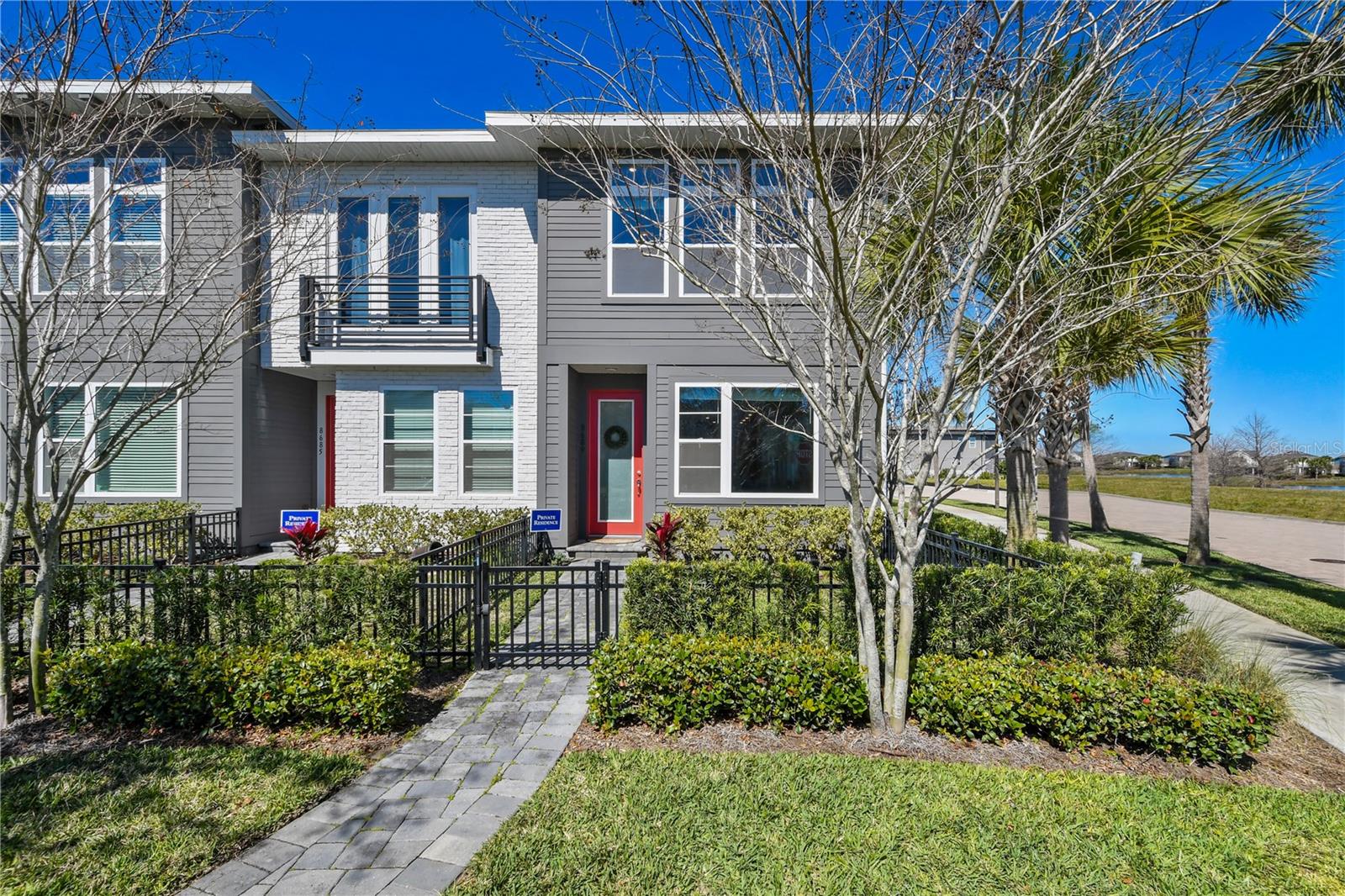 Welcome to a Lifestyle of Elegance and Comfort at this Stunning 2-Bedroom, 2-Bathroom Townhouse situated on a Corner Lot in Laureate Park, Lake Nona, Orlando, FL. This IMPECCABLY Designed Home Features a SPACIOUS OPEN Floor Plan, a Modern Kitchen with Premium Appliances, and a Private Master Suite. With abundant Natural Light and Serene Views, this home offers a Tranquil Retreat. Enjoy spectacular curb appeal and a Maintenance free Outdoor Living Space in your Quaint Front Garden space. As you enter, you will find Laminate flooring throughout the first floor of your new home. Your Family Room, Dining, and Kitchen Combo offers a great space to settle down after a long day or entertain your family and friends. Your Stunning Kitchen Features Light Bright High End Cabinets, Upgraded Quartz Countertops, Stainless Steel Appliances, and custom features like trash can pull out, air switch for your disposal, and pot and pan drawers. Just off the kitchen, a half bathroom, and your garage that includes a 4-unit Shelving for plenty of storage space. Upstairs, you will find a spacious walk-in Laundry. Off the Laundry is your PERFECT LOFT SPACE. Off your loft space is a Full Bathroom with a single vanity and tub shower, along with a Bedroom that has its own walk-in closet. Down the hall, this split floor plan offers great privacy for the Master Suite. As you enter, you will find French Doors that lead into your Master Ensuite featuring Double Vanities, Walk In Shower, Light Bright Cabinets, Quartz Countertops, Beautiful 12x24 Tile Flooring, a Private Toilet Closet, and an Oversized Walk In Closet. Your Spacious Bedroom has Large Windows offering loads of Natural Light. Enjoy the ease of access being walking distance to community amenities, Lake Nona’s Canvas Restaurant, proximity to Medical City, and top-rated schools. Your perfect blend of luxury and convenience awaits in this desirable Lake Nona location. HOA Includes HIGH-SPEED INTERNET of up to 1GIG, LP Fitness Center, Resort-Style LP Aquatic Center with Beach Volleyball Court and a half Basketball Court. Laureate Park also offers Community Gardens, Dog Parks, Playgrounds, and Miles of Trails to enjoy Walking, Running, and Biking. Enjoy Community Activities like Live and Local, Movies in the Park, Yoga, and more. Located in the heart of Lake Nona Medical City with BEEP autonomous shuttle service and Minutes to Orlando International Airport, Major Highways, Shopping, Dining, USTA, and KPMG.
