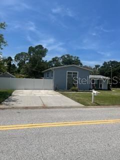 Stunning 3-Bedroom Corner-Lot Home with Exceptional Curb Appeal! Welcome to this beautifully maintained 3-bedroom, 2-bath home situated on a prime corner lot, offering both style and functionality. The spacious property boasts two driveways for ample parking and a large fenced backyard complete with an awning-covered patio—perfect for outdoor entertaining or relaxing in the shade. Step inside to discover a chef-inspired kitchen featuring double wall ovens, a large island with breakfast bar, and an open layout that flows seamlessly into the expansive family room. Just off the sunken formal dining area, you’ll find the perfect space for hosting elegant dinners or casual gatherings. Up a short half-staircase in this unique multilevel home, you’ll find three inviting bedrooms with gorgeous hardwood floors and two fully renovated bathrooms showcasing modern finishes. This home combines comfort, style, and convenience—and with lawn care included, you can enjoy a low-maintenance lifestyle.