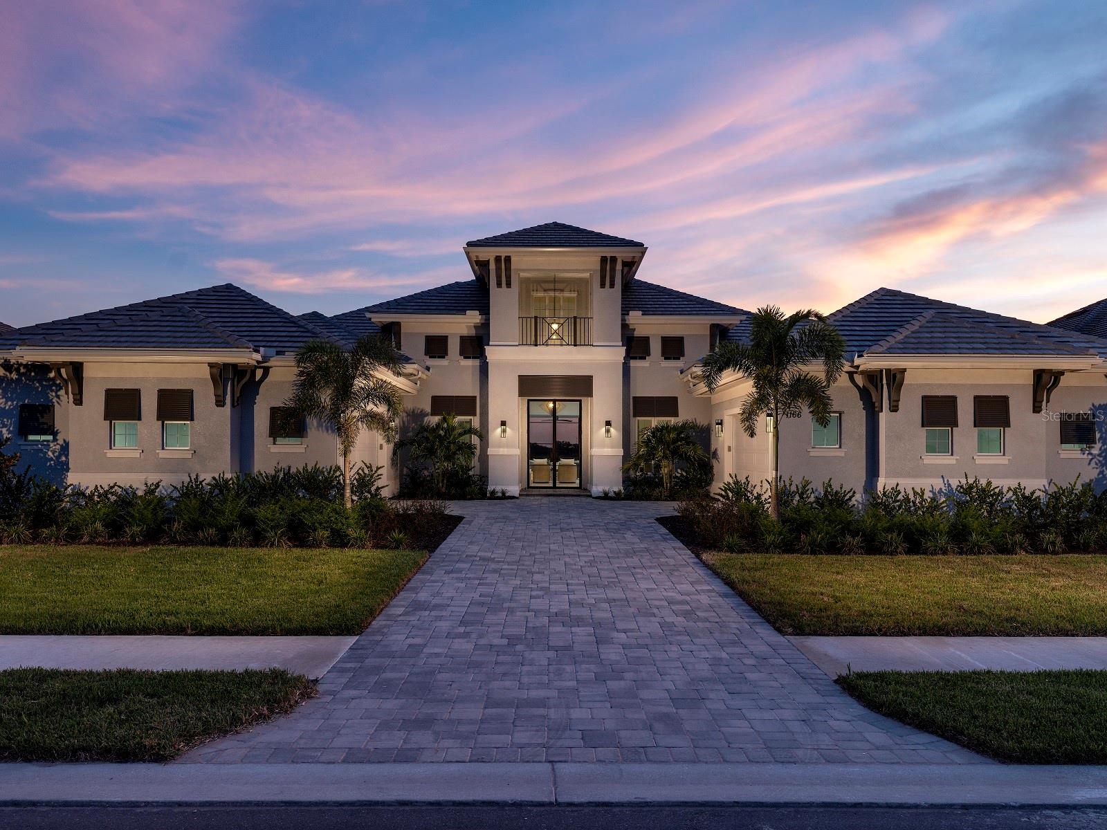 Welcome to Wild Blue at Waterside, where luxury coastal living meets natural beauty. Stock Luxury Homes presents an exquisite blend of timeless architecture, semi-custom details, and expansive open spaces. This stunning CLAIRBORNE II MODEL HOME features 4 bedrooms, 4.5 bathrooms, a spacious Great Room, elegant Dining Room, a dedicated Study, exercise studio and 4 car garage. Enjoy seamless indoor-outdoor living with a dynamic outdoor space complete with a pool, spa, outdoor kitchen and fireplace. This MODEL HOME is being sold with leaseback terms through January/February 2026. This Quick Close Sales Price includes the furniture and decor package!