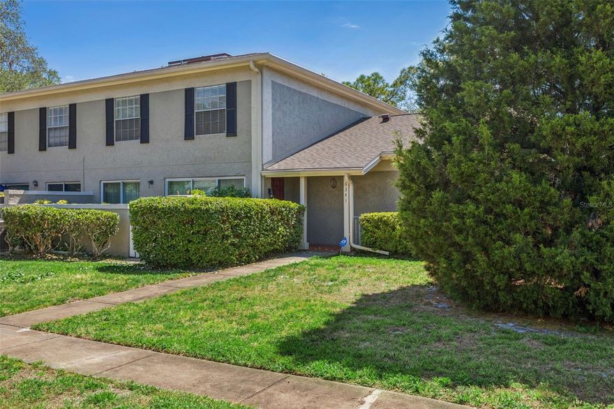 Welcome to the peaceful Raintree Manor community. Featuring 2 spacious bedrooms and 1 and a half baths, this end unit home is move in ready for it's next owners. Downstairs features a large open living room and dining room combo. The galley kitchen features custom cabinets and granite countertops, with stainless steel appliances. The home features a private courtyard as a bonus off the dining room. A half bath downstairs is convenient for your guests. Upstairs, you will find 2 spacious bedrooms and a shared full bath that has been recently remodeled. This unit also boasts a single car garage with laundry units included. The Raintree Manor community amenities include two large pools, tennis courts for active lifestyles and a clubhouse for gatherings and social events. There is also an RV/Boat storage area for added convenience, mature oak trees provide a tranquil and scenic environment. Raintree Manor is ideally located just minutes from USF and I-75, offering easy access to nearby shopping, dining, and entertainment options.  HOA fee includes water, sewer, trash, recycling, basic cable, basic internet, landscaping, and exterior maintenance including the roof. Come see this home before it's gone!