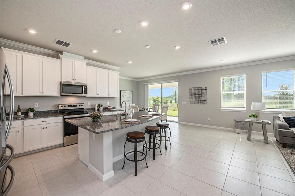 Photo of 2326 Village Amble Loop, Lutz, FL 33558 (MLS # TB8480848)