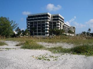 Lido Beach condo in Lido Surf and Sand, with a large porch overlooking views north up Lido Beach. Step into this split plan two bedroom, two bathroom condo with views that are breathtaking. The condo has porcelain tile floors and stylish furniture.