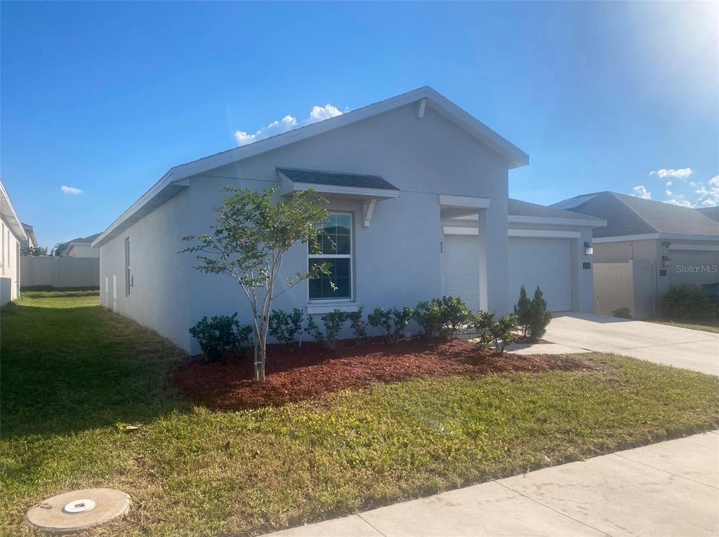 Photo of 656 Tanaro Lane, Haines City, FL 33844 (MLS # O6445914)