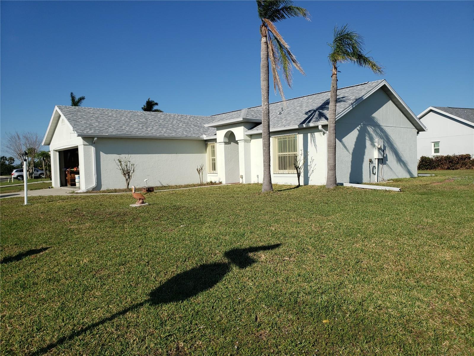 Charming 3 bedroom, 2 bathroom home on quiet corner lot in Palmetto! This home comes partially furnished with couches, dining table, beds, and dressers. The spacious main bedroom features a walk-in closet and ensuite bathroom. Custom shelving can be found in the dining area, extended pantry, and one guest bedroom. Sliding doors off the living room provide access to a patio with pond and conservation area views.