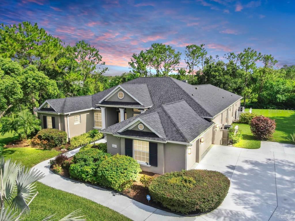 Welcome to 21803 Deer Pointe Xing, an elegant retreat nestled within the Preserve at Panther Ridge - one of the most private and scenic communities in Lakewood Ranch. Set on a 1.07-acre wooded lot with tranquil pond views, this custom residence offers exceptional privacy while still enjoying the convenience of nearby shopping, dining, and access to top-rated schools including McNeal Elementary, Nolan Middle, and Lakewood Ranch High.
This thoughtfully designed 4 bedroom, 3 bath home includes a dedicated office, formal living and dining rooms, and an oversized kitchen that flows into a spacious great room with disappearing sliders to the screened lanai. Recent upgrades include luxury vinyl plank flooring, expanded driveway, custom closet systems, electronic and smart home features, a brand-new Trane air-conditioning system (2024), and a new roof.
Outdoors, enjoy a peaceful and private setting with a heated pool, outdoor kitchen, private fire pit, and two covered seating areas - all surrounded by mature landscaping and wooded views. Additional highlights include a Tesla charger, generator interlock switch, whole-house reverse osmosis water system, expanded driveway, Invisible Fence Electric Dog fence, and a full smart home infrastructure with Brilliant, Hue lighting, Ring cameras, and Sonos sound throughout.
With low HOA fees, no CDD, and unmatched privacy in one of Lakewood Ranch's most desirable neighborhoods, this home offers the best of Florida living.