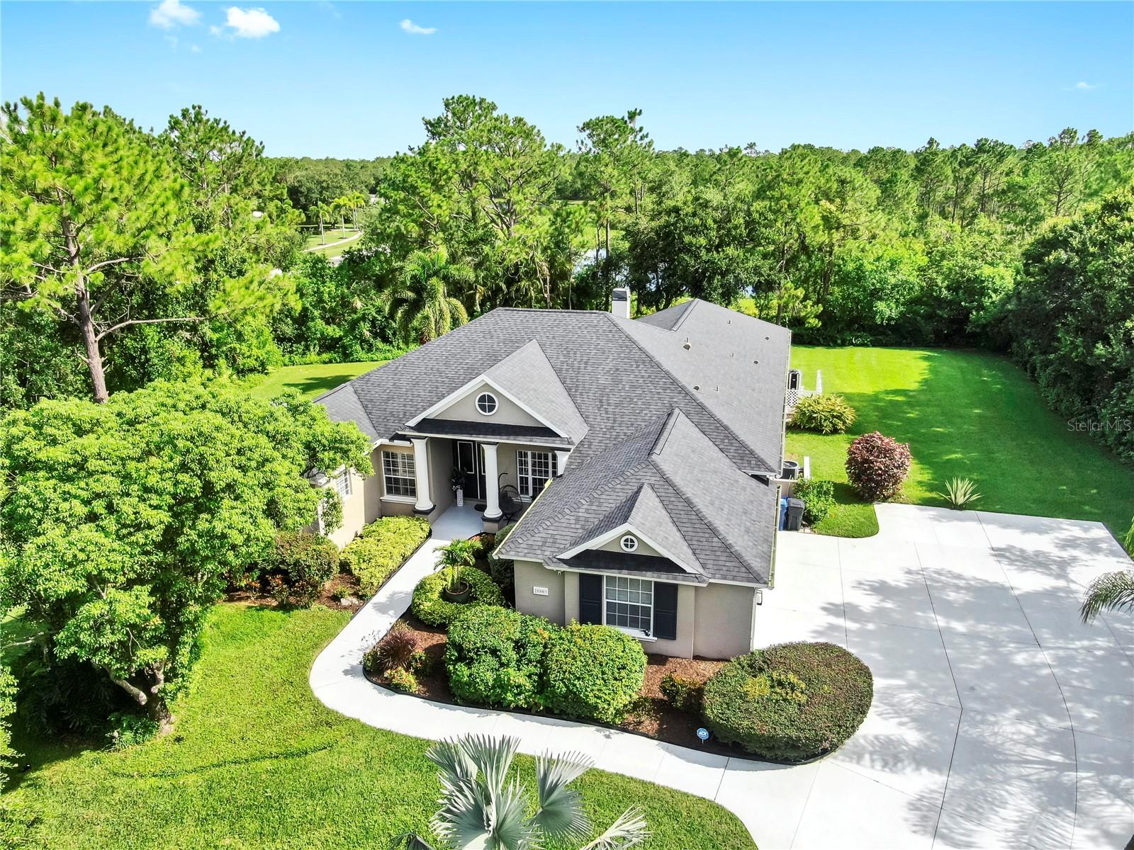 Welcome to 21803 Deer Pointe Xing, an elegant retreat nestled within the Preserve at Panther Ridge - one of the most private and scenic communities in Lakewood Ranch. Set on a 1.07-acre wooded lot with tranquil pond views, this custom residence offers exceptional privacy while still enjoying the convenience of nearby shopping, dining, and access to top-rated schools including McNeal Elementary, Nolan Middle, and Lakewood Ranch High.
This thoughtfully designed 4 bedroom, 3 bath home includes a dedicated office, formal living and dining rooms, and an oversized kitchen that flows into a spacious great room with disappearing sliders to the screened lanai. Recent upgrades include luxury vinyl plank flooring, expanded driveway, custom closet systems, electronic and smart home features, a brand-new Trane air-conditioning system (2024), and a new roof.
Outdoors, enjoy a peaceful and private setting with a heated pool, outdoor kitchen, private fire pit, and two covered seating areas - all surrounded by mature landscaping and wooded views. Additional highlights include a Tesla charger, generator interlock switch, whole-house reverse osmosis water system, expanded driveway, and a full smart home infrastructure with Brilliant, Hue lighting, Ring cameras, and Sonos sound throughout.
With low HOA fees, no CDD, and unmatched privacy in one of Lakewood Ranch's most desirable neighborhoods, this home offers the best of Florida living.
