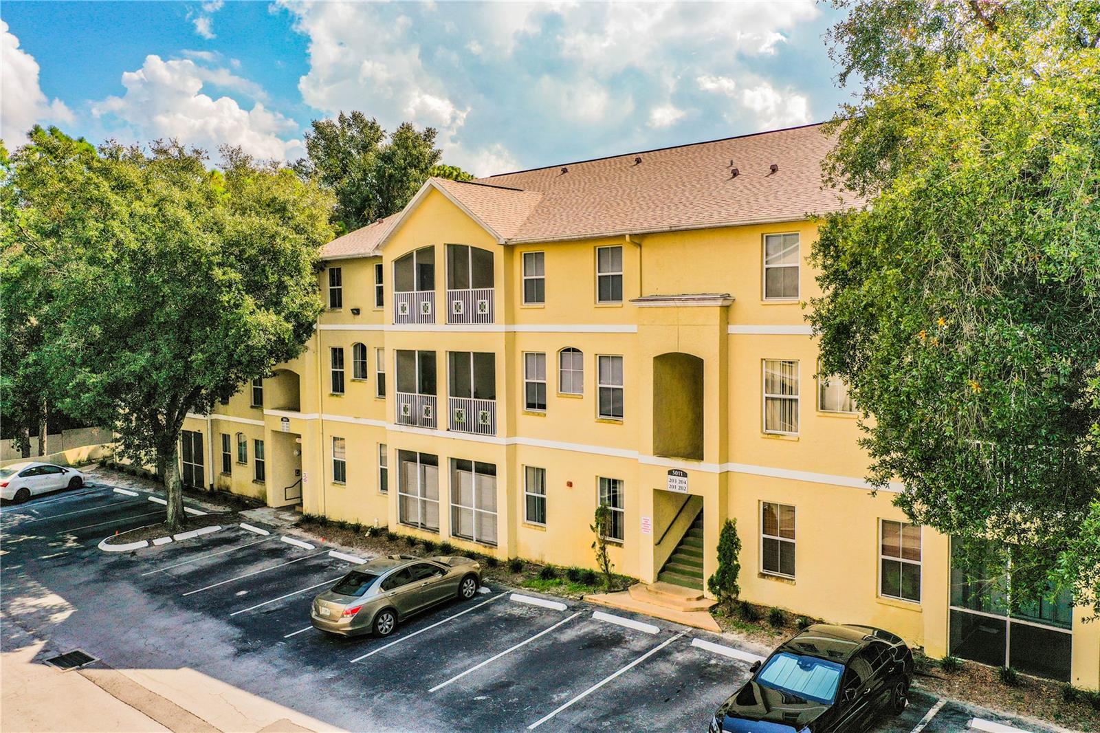 This spacious 2 bedroom 2.5 bath condo is located on the second floor and has 1470 square feet. Home features a great room with dining area, galley kitchen with breakfast bar, closet style pantry, inside laundry with washer and dryer included, NEW luxury vinyl plank flooring in living areas and new A/C System as of 2020. Each bedroom has an ensuite bathroom and spacious walk-in closet. Enjoy time on the private screened in patio or at the many community amenities including the resort style pool. Fantastic and convenient location within minutes of USF, Moffit Cancer Center, the VA Hospital and MOSI, with quick highway access. Make it your personal home or a rental investment today! Please note that the kitchen photos were taken prior to luxury vinyl flooring being installed; all the downstairs living spaces now have new luxury vinyl flooring.