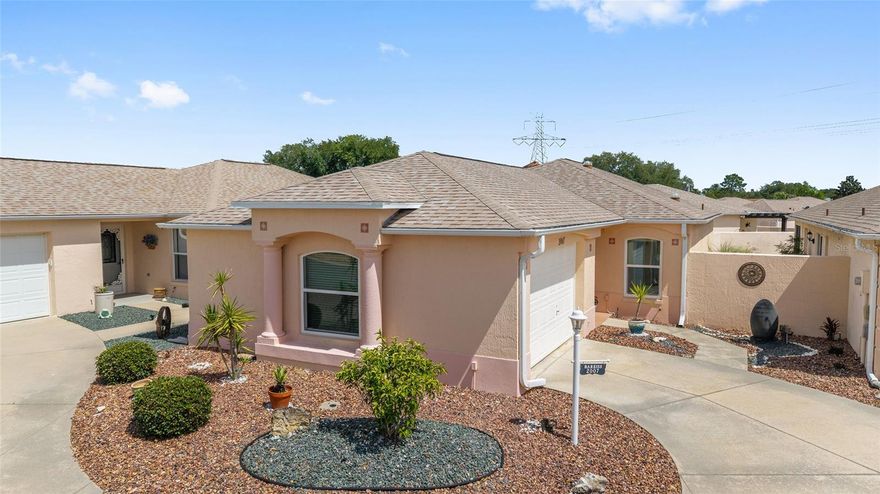 BOND PAID!!!! on this PARTIALLY FURNISHED & BEAUTIFULLY MAINTAINED BLOCK & STUCCO Courtyard Villa tucked away on a QUIET CUL-DE-SAC in the highly sought-after Village of Santo Domingo in The Villages! This charming 2-bedroom, 2-bath home offers the perfect blend of COMFORT, CONVENIENCE, and LOW-MAINTENANCE Florida living. Filled with NATURAL LIGHT from 3 SOLAR TUBES, the OPEN and INVITING floor plan features spacious living and dining areas, and GRANITE countertops in the kitchen. The GLASS-ENCLOSED LANAI is perfect for YEAR-ROUND enjoyment, adds additional living space and leads to LOW-MAINTENANCE ROCK LANDSCAPING. 

Major updates provide peace of mind, including PELLA WINDOWS & DOOR (2022), ROOF (2017), HVAC (2017), HOT WATER HEATER (2019), plus an ATTIC SOLAR FAN for added efficiency. The FRESHLY PAINTED 1.5 GARAGE adds to the pride of ownership seen throughout the property. Ideally located near several GOLF COURSES, recreation centers, shopping, dining, SPANISH SPRINGS Town Square, and LAKE SUMTER LANDING Market Square, this villa is the perfect FULL-TIME RESIDENCE, SEASONAL ESCAPE, or INVESTMENT OPPORTUNITY in one of Florida’s most vibrant 55+ communities!