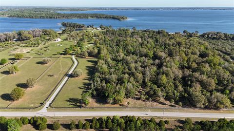 Photo of 12115 SE Sunset Harbor Road, Weirsdale, FL 32195 (MLS # OM696243)