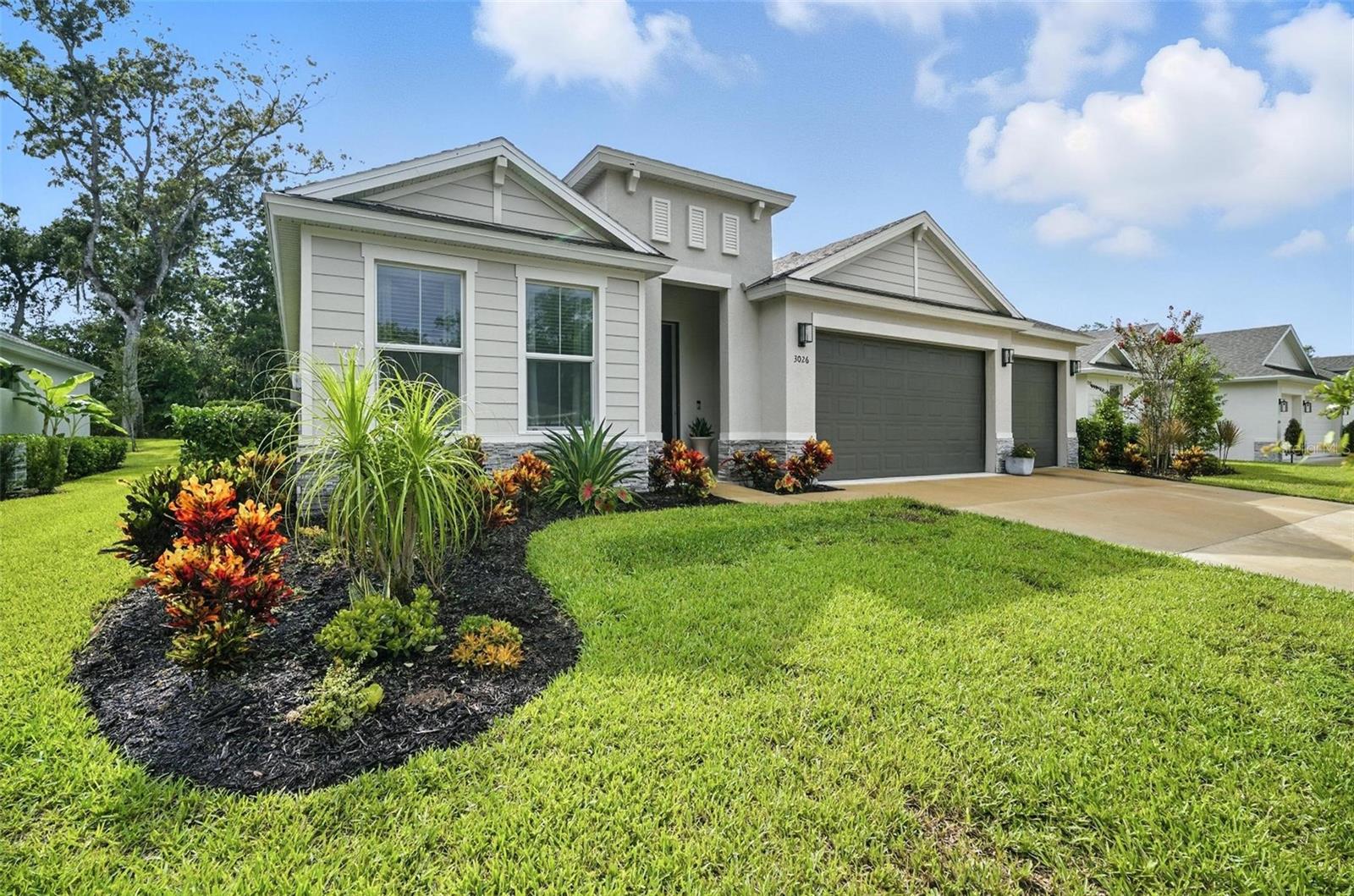 Discover modern elegance at 3026 Adrian Drive in Ormond Beach. Built in 2022, this 3-bedroom, 3-bath home offers 2,232 sq. ft. of open, light-filled living space with a gourmet kitchen that’s perfect for cooking and entertaining. The primary suite features a high-end bathroom with dual vanities and a beautifully tiled walk-in shower. Each additional bedroom has its own bath, ideal for family or guests, and a large laundry suite. Step outside to a screen enclosed porch and enjoy a your serene, oasis-like backyard with exceptional landscaping—perfect for relaxing or hosting friends. This home is part of a vibrant community with a clubhouse offering a full restaurant, sports bar, fitness center, tennis facilities, golf course, locker rooms, and a huge pool. Enjoy the peace of a secluded setting while staying connected via easy access to major roadways and the stunning Ormond Beach coastline. With a Zestimate® of $551,300 and strong local comps, this home combines modern comfort, style, and lifestyle. Don’t wait—schedule your visit today and experience it in person. All information herein is deemed reliable but not guaranteed. No representations or warranties, express or implied, are made as to the accuracy of the information. Buyers shall conduct their own due diligence to verify all facts, conditions, and specifications prior to purchase.