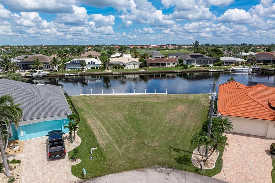 WATERFRONT, GULF ACCESS KEY LOT IN BSI W/140 FT OF SEAWALL & NEW MAXIMUM SIZE DOCK!  The dock was installed by Keesling Construction and is 10’ wide and over 120’ in length - Looking to build your Florida dream home? This oversized lot on a quiet street offers a wide canal view and boating access through the recently widened channel into Alligator Creek. Start enjoying some of the best fishing & boating in SW Florida directly from your backyard. Enjoy beautiful sunrises over the canal every morning. Lot is ready for your new construction to begin. Claim your spot in paradise today! BSI is a deed-restricted, waterfront & golf community. Run your errands without leaving the neighborhood - Burnt Store Marketplace is located at the entrance of Burnt Store Isles & offers Publix, Home Depot & several other retail & salon/service stores. Enjoy easy access to US41 or I-75.