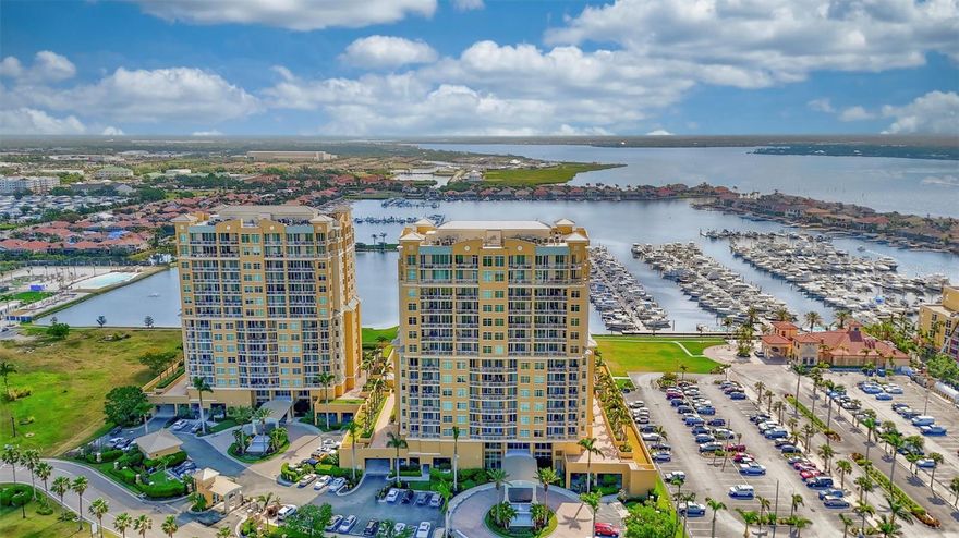 VERY RARE OPPORTUNITY TO OWN A PENTHOUSE!! This exceptional 15th floor PRIVATE ELEVATOR PENTHOUSE at Bel Mare in Riviera Dunes offers refined WATERFRONT living with expansive views of the Manatee River and the evening skyline. Elevated high above the water, the residence blends architectural elegance with thoughtful upgrades and coastal sophistication throughout. The reimagined SPLIT FLOORPLAN includes three bedrooms plus an office/den, soaring ceilings, walls of glass, and custom craftsmanship rarely found in today’s market. The home features THREE PRIVATE BALCONIES, each capturing a different perspective of the river and skyline. The great room showcases CUSTOM BUILT-IN cabinetry framing a modern GAS FIREPLACE with a black granite surround, creating a striking focal point day and night. The GOURMET KITCHEN has been redesigned with a single-level QUARTZ island, Sub-Zero refrigeration, a six-burner gas cooktop, new convection double wall ovens, a Bosch paneled dishwasher, an industrial-capacity vent hood, and a quartz undermount sink. The OPEN LAYOUT creates an ideal flow for entertaining. The large primary suite offers sweeping waterfront views and a beautifully designed layout that includes an entry WET BAR with a sink, ice maker, and beverage refrigeration. Additional features include two spacious WALK-IN CLOSETS, a spa-style bathroom with a jetted SOAKING TUB, a walk-in shower, custom cabinetry, and an adjacent FLEX SPACE that opens to a private waterfront balcony. Two additional guest suites provide comfort and privacy, each thoughtfully designed for separation and ease. A rare feature for condominium living, this residence includes a PRIVATE TWO-CAR GAARAGE located inside the secured parking garage, along with an additional assigned parking space. These elements elevate convenience, security, and storage options well beyond what is typically found in penthouse living. The home includes EXTENSIVE UPGRADES such as Hunter Douglas energy-efficient shades, Vista UV and heat-control window film, approximately eighteen hundred linear feet of added crown molding, designer mirrored accent walls, South American hardwood flooring in one bedroom, polished and sealed TRAVERTINE in the main living areas, custom cabinetry throughout, three Trane variable-speed HVAC systems with UV lights installed in 2021, a Halo air PURIFICATION SYSTEM, a high-efficiency Rheem water heater installed in 2023, and a whole-house Pelican WATER FILTRATION system with sediment filter and REVERSE OSMOSIS at the kitchen sink. Bel Mare is regarded as one of the area’s premier waterfront communities and offers RESORT-STYLE AMENITIES including four pools, guest suites for visiting friends and family, a fitness center, a theater room, billiards, tennis and pickleball courts, and access to the private Riviera Dunes deep-water marina. The location provides convenient access to Sarasota, St. Petersburg, Tampa, and Lakewood Ranch, placing residents within close reach of beaches, dining, arts, golf, and multiple international airports. This penthouse combines architectural scale, curated design, protected water views, and exclusive amenities, creating a rare offering along the Gulf Coast.