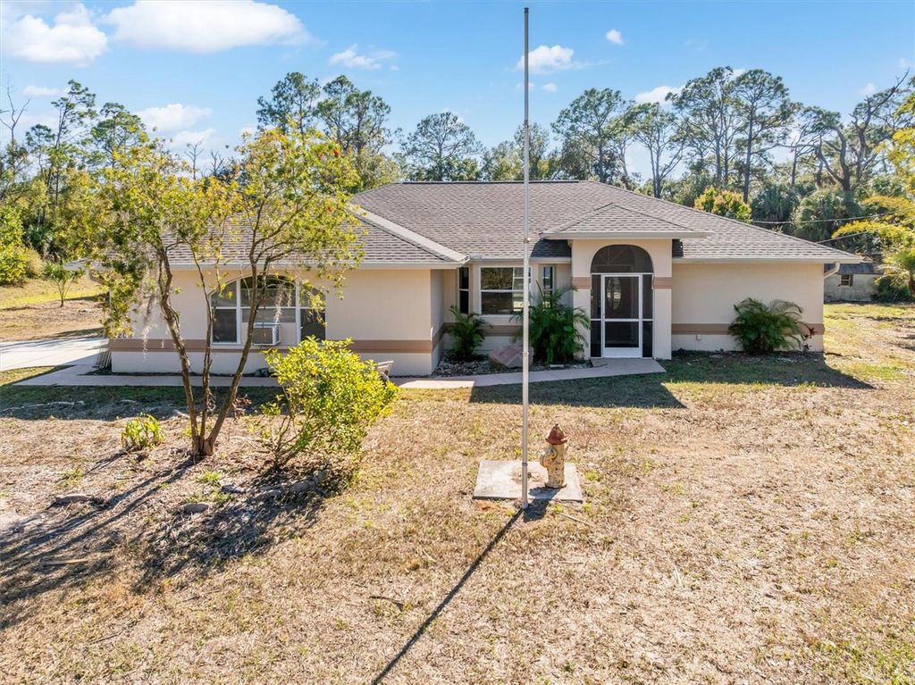 Photo of 2209 Tropicaire Boulevard, North Port, FL 34286 (MLS # C7517436)