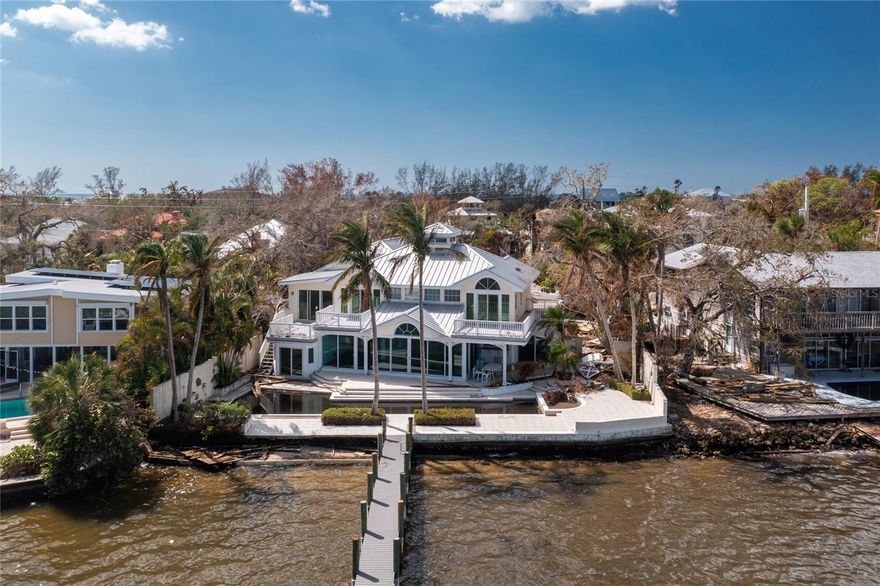 This Siesta Key Bayfront property presents an exceptional opportunity to build your custom waterfront retreat. The existing house is a tear-down, allowing you to start fresh with a design that maximizes the stunning, unobstructed views. With the dock and lift, both installed in 2020, adding immediate value, and Gulf access just minutes away thanks to the reopening of Midnight Pass, this property is a boater's dream. Located on the serene south end of Siesta Key, you’ll enjoy peace and privacy while being close to the world-famous "#1 Beach in the USA" and the vibrant Siesta Key Village. This prime location offers both a tranquil lifestyle and easy access to top local amenities.