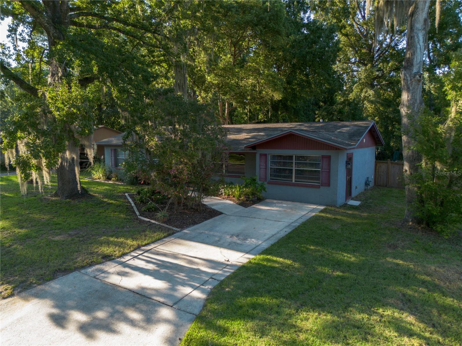 Welcome to this freshly updated 4-bedroom, 3-bathroom home tucked away in NW Gainesville. With a smart 2-way split plan, you’ll enjoy not one, but two primary suites, each with its own private bath. The 4th bedroom even has a separate exterior door—perfect for a short-term rental, man cave, or the ultimate Gator fan’s retreat just in time for football season!
Step outside and enjoy a large fenced yard filled with extras: a cozy fire pit, covered wood storage, chicken coop, garden space, playground, a 10x10 workshop with power, and a metal shed for tools. Mature trees surround the property creating shade and charm and come with an arborist’s stamp of approval.
Recent updates mean peace of mind: HVAC (Aug 2025), water heater (Apr 2025), rewiring (2014), updated bathrooms, fresh paint inside, and a brand-new roof coming before closing. Plus, the large screened-in porch is the perfect spot to unwind year-round.
With no HOA and a prime NW Gainesville location, this home offers flexibility, character, and plenty of room to enjoy both inside and out. Don’t miss your chance to make it yours!