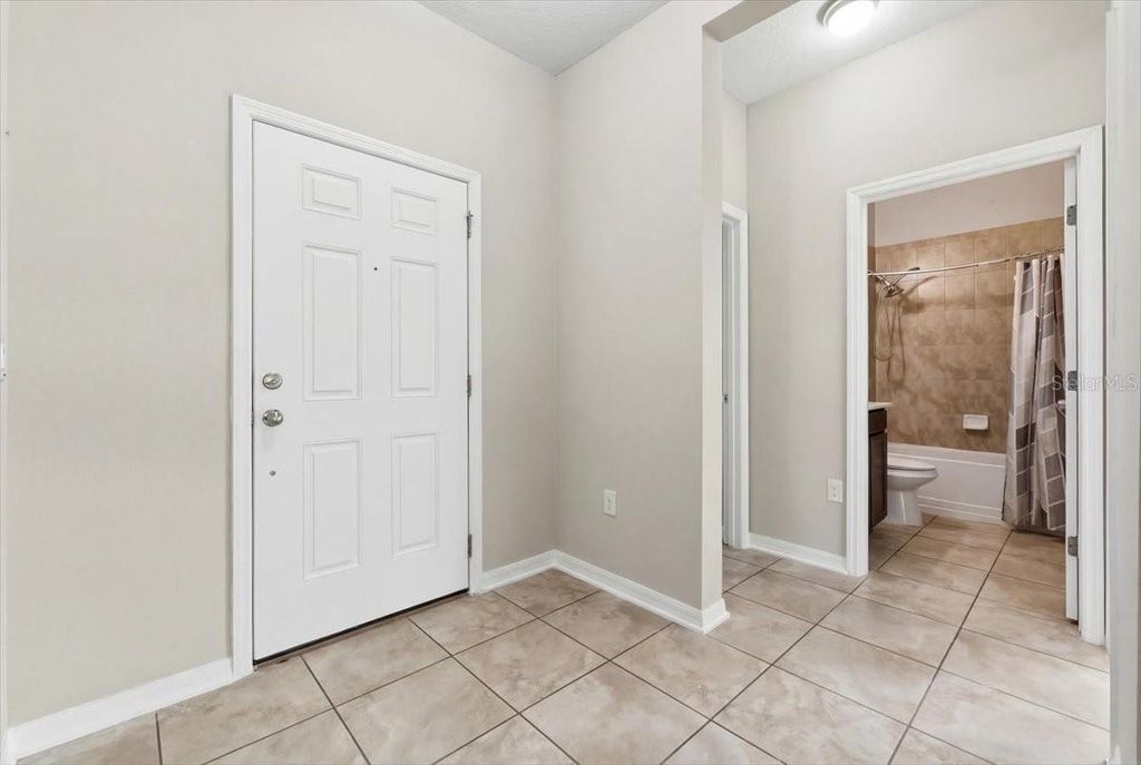 Photo of 215 Lakeshore Drive, Davenport, FL 33837 (MLS # O6390226)