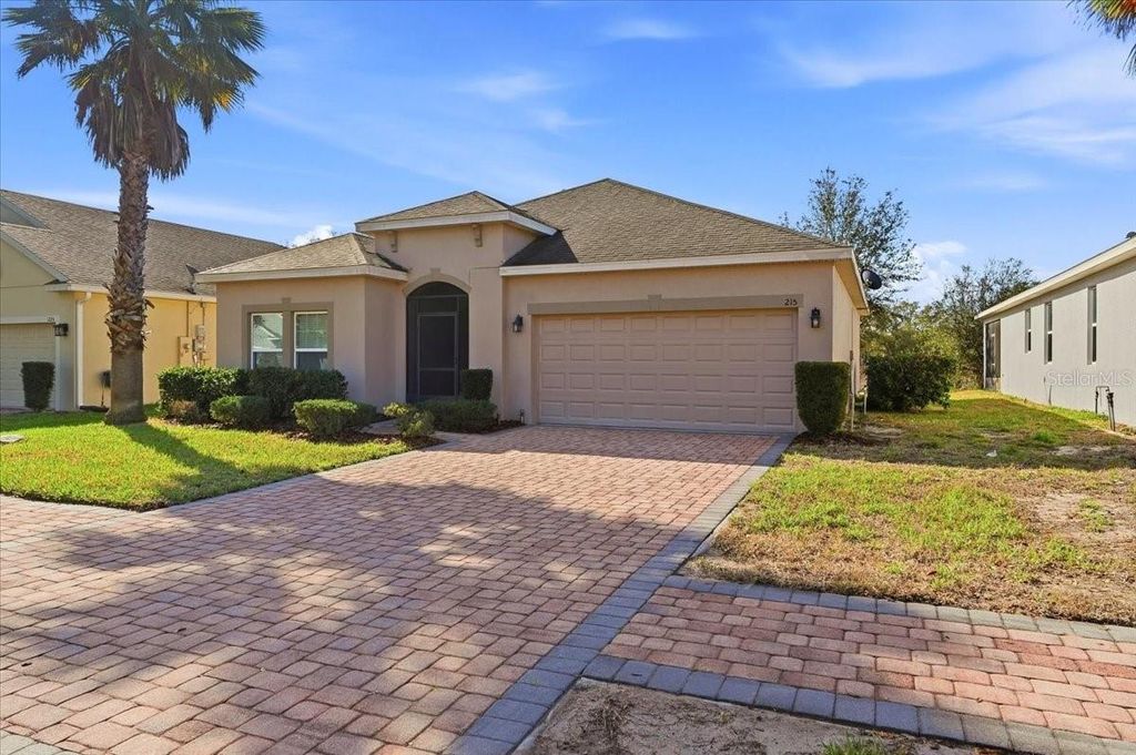 Photo of 215 Lakeshore Drive, Davenport, FL 33837 (MLS # O6390226)