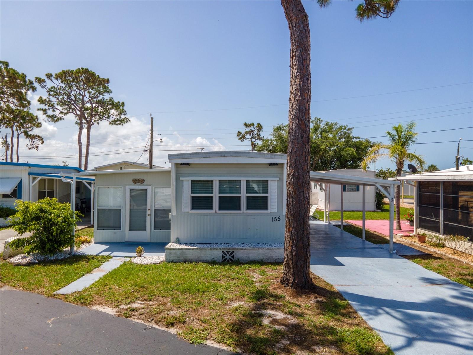 Ditch the snow shovel and grab your sunglasses, your slice of Florida paradise awaits! Why spend another winter bundled up when you could be basking in the sunshine LESS THAN 4 MILES FROM MANASOTA BEACH? Whether you're looking for the perfect seasonal escape or a full-time retreat, this charming 2-bedroom, 1-bath mobile home in the friendly 55+ community of Oak Grove boasting a community pool offers unbeatable value and endless fun under the sun.
***Step from your inviting front porch into the sun-kissed Florida room, ideal for morning coffee, a good book, or simply relaxing in cool A/C surrounded by natural light. Inside, the cozy living room welcomes you to kick back and catch the big game, while the spacious kitchen, complete with laminate floors and ample cabinetry, snack prep and entertaining is a breeze. The adjoining dinette is perfect for sit-down meals or board game nights with friends.
~~~The bright and airy primary suite boasts LUXURY VINYL PLANK flooring, a large closet, and a vanity to streamline your morning routine. A generously sized bathroom offers plenty of space to store your essentials, yes, including all that sunscreen! The second bedroom, located just off the Florida room, is a versatile bonus. Use it for guests, a craft room, or even a home office. Outside, enjoy the convenience of a covered carport and two storage sheds, one with laundry. The newer tankless water heater provides endless hot water on demand while saving space and energy, perfect for efficient, comfortable living.
***At Oak Grove, you are not just buying a home, you are joining a vibrant community. Spend your days lounging by the pool, playing shuffleboard, or socializing at the rec center. Explore the four pristine beaches of Manasota Key, hunt for sharks’ teeth, or enjoy the restaurants, boutiques, and events along historic Dearborn Street. You're also minutes from Venice Island, Downtown Wellen Park, world-class golf, boating, and endless Gulf Coast adventures.
~~~Homes at this price in this location don’t last long, especially this close to the beach. Call today to schedule your private showing and start living the Florida lifestyle you have been dreaming of!