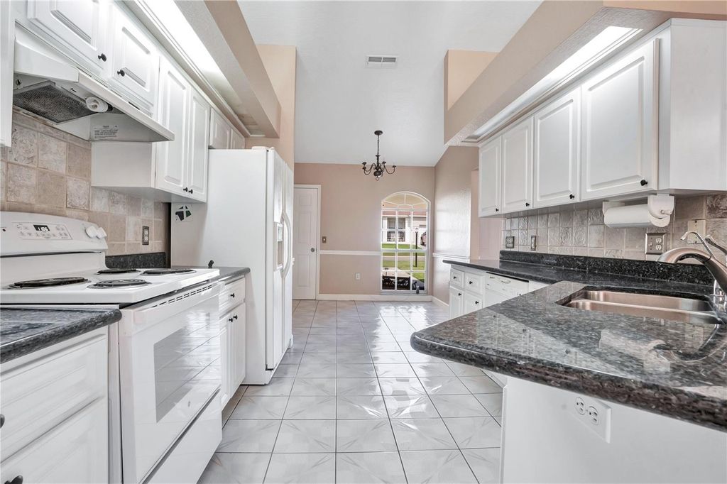 Photo of 667 Jessanda Cir, Lakeland, FL 33813 (MLS # O6426054)