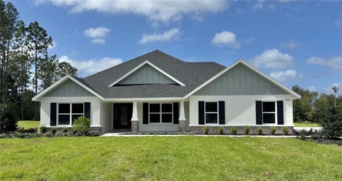 Photo of 18441 SW 66th Loop, Dunnellon, FL 34432 (MLS # OM734792)
