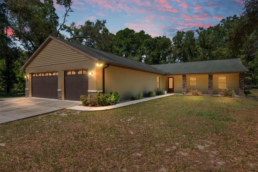 Gorgeous concrete block, stucco home on 10 acres, custom built by owner/builder, FOR the owner, so it's beautifully made and well-built!! Every detail in this home is beautiful, from ceramic tile flooring to tall doorways, high ceilings, elegant bathrooms, large bedrooms. The master suite is huge with a beautiful stone fireplace, home has 2 fireplaces that are gas or wood-burning! Large bathroom with shower and a private outdoor shower! There is a detached air-conditioned garage that has a 2-car lift and can hold 18+ cars, it also has 3 18 x 10 ft automatic doors! Plus another detached garage that has been used for multiple tractors and utility vehicles and has a 16 x 10 door. The attached garage on the home holds 6 cars! There's also an area in the house garage where plumbing and electrical are set up so it can have an extra primary or guest suite added. The block is already insulated! Some extras include: $40,000 in millings ( a great crushed asphalt driveway, whole house generator with 1000 lb propane gas tank underground. Most tanks are 500 lbs, they doubled it! Solar Panels (bill is $90 in summer,$45 in winter) SAFE ROOM with VAULT DOOR!! Deep Freezer, Greenhouse, 2 Chicken Coops with run, fenced-in Garden Area with 3 raised beds, Automatic ghost Gate at entry-way. In Chiefland, close to town with all the amenities, but far away enough so it's quiet and you're really in the country. 45 min to G'ville/Ocala.