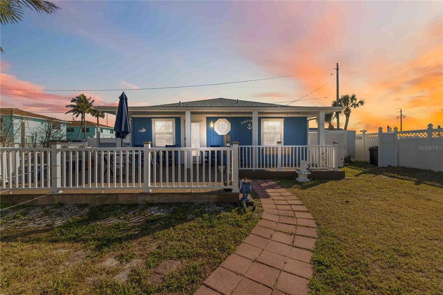 Experience the peak of coastal living in this fully turnkey, elevated residence, where the rhythm of the Gulf of Mexico meets refined island design. Offered completely furnished and move-in ready, this two-bedroom, two-bathroom home allows for an immediate transition into the Bradenton Beach shoreline experience.

The interior is bathed in natural light, highlighting an open-concept layout with a designer kitchen featuring granite countertops, a custom tile backsplash, and stainless steel appliances. Both bathrooms have been elegantly updated with modern stone finishes and contemporary fixtures. Outside, a sprawling wrap-around deck offers an expansive venue for sunset views and open-air relaxation.

The ground level provides significant versatility with a large, covered area for secure parking and storage, alongside a private, fenced retreat featuring a personal spa. With rare commercial zoning, this property offers exceptional potential as a primary residence, a seasonal escape, or a high-performance investment. From the meticulously curated decor to the updated systems, every detail is in place for the next owner to simply arrive and enjoy.
