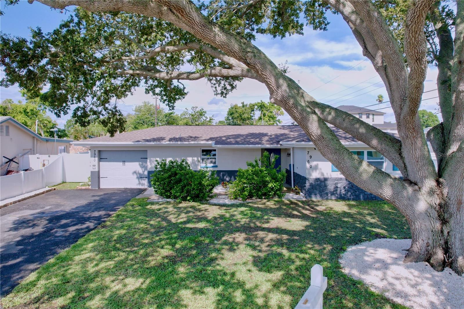 Modern luxury meets Florida charm in this gorgeous, fully renovated 3BR/2BA St. Pete home. HUGE backyard, designer finishes, and a location everyone wants — welcome to Riviera Bay!
Beautifully remodeled and professionally remediated after recent hurricanes, this home blends modern style, thoughtful upgrades, and an unbeatable location in the heart of St. Pete’s coveted Riviera Bay area. Featuring open concept living with lots of natural light, a split floor plan for privacy, and a 1-car garage with washer/dryer hookups, this move-in ready home offers the perfect blend of style and everyday comfort. The designer kitchen features brand-new cabinetry, stainless steel appliances, and massive quartz countertops with seating — perfect for entertaining. A stunning new electric fireplace creates a warm focal point, while wood-grain porcelain tile flooring flows seamlessly throughout.
Both bathrooms have been tastefully updated, and the home comes equipped with a top-of-the-line Vivint security system for peace of mind. The spacious primary suite impresses with custom barn doors leading leading, on one side, to an en-suite bathroom with a gorgeous dual vanity, and a spacious walk-in closet on the other.
Step outside to your HUGE fully fenced backyard — complete with a generous new patio, designated fire pit and hammock areas, and plenty of space for a future pool. Mechanical upgrades include a new roof and gutter system (2023), newer electrical and upgraded A/C (2019), hurricane-rated windows, and an upgraded sewer line.
Set at the end of a quiet cul-de-sac, the home is fully wheelchair accessible. Just across the street, a charming walkway leads to the river opening into the bay — ideal for fishing, walking your dog, or catching a serene sunset. You’re also steps from a neighborhood trail to Rio Vista Park, perfect for biking, jogging, or weekend picnics.
Turnkey, stylish, and ideally located — this home offers the best of coastal living with nothing left to do but move in. Don’t miss out on this gem in one of the best locations in St. Pete!