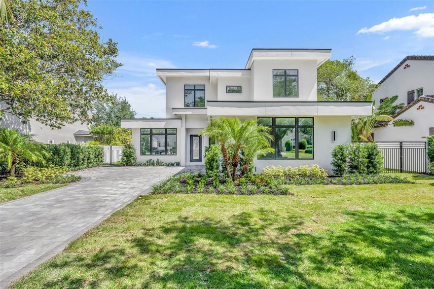 Gorgeous brand new pool home built by Ellsworth Gallimore. Situated on a lovely brick street in prime Winter Park location on 0.27 acre lot. Outstanding floorplan and abundant high-end amenities including warm, white oak wood floors throughout living areas and all bedrooms, quartz counters, Pella windows & solid core doors. Great room has wine cooler, 12' ceilings, 6' electric fireplace with glass beads surrounded by floating shelves, Pella sliding doors to lanai & is open to dining room & kitchen. Generous light and bright kitchen features large island with seating, stainless farmhouse sink, upgraded LG Signature appliances, gas cooktop and gorgeous quartz counters. Downstairs master suite includes large custom closet with built-ins, beautiful bathroom with free standing tub, dual vanities, plus shower featuring body sprays, 2 heads, handheld & shower seat. Office plus 2nd flex space downstairs, laundry room & abundant storage. Upstairs you will find 3 bedrooms each with their own bathroom & generous closet, plus bonus family room. Living, dining and master all open to warm & inviting lanai which showcases tongue & groove ceiling, retractable screens, 16 x 24 sand blasted marble tile, summer kitchen, exterior ½ bath plus outdoor shower and sparkling saltwater pool with water feature. TPO commercial grade flat roof, hybrid 80 gallon water heater, 2 car garage, 2 AC's, pavered driveway, vinyl fence & so much more.