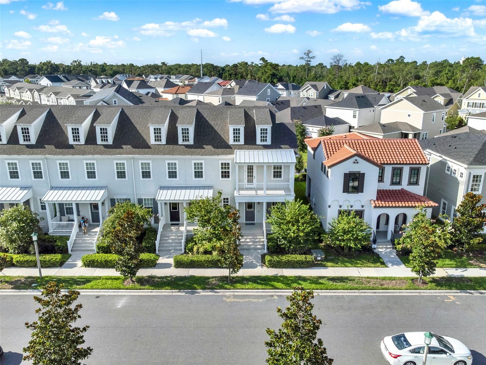 Step into the vibrant lifestyle of Celebration’s newest neighborhood—Island Village—where timeless charm meets modern design. This beautifully crafted end-unit townhome by Mattamy Homes offers the perfect blend of sophistication, comfort, and community.
Boasting 3 spacious bedrooms and 2.5 baths, this townhome is thoughtfully designed with an open, light-filled floor plan that invites effortless entertaining and relaxed everyday living. The gourmet kitchen is a showstopper, featuring sleek cabinetry, premium appliances, and an oversized island that serves as the heart of the home. Upstairs, the luxurious primary suite offers a peaceful retreat, complete with a spa-inspired bathroom and generous walk-in closet. As an end unit, the home is bathed in natural light and offers added privacy. High-end finishes and tasteful details throughout elevate the living experience at every turn. Located in Island Village at Celebration, this exciting new chapter of the iconic town continues Walt Disney’s original vision—a place where community, connection, and quality of life come together seamlessly. Residents enjoy access to brand-new resort-style amenities, scenic walking trails, parks, playgrounds, and top-rated schools. And just minutes away, downtown Celebration offers charming boutiques, waterfront dining, seasonal events, and a strong sense of community that makes this town so special. Whether you're looking for a full-time residence or a stylish retreat, this home places you at the heart of it all—where modern living meets the magic of Celebration.