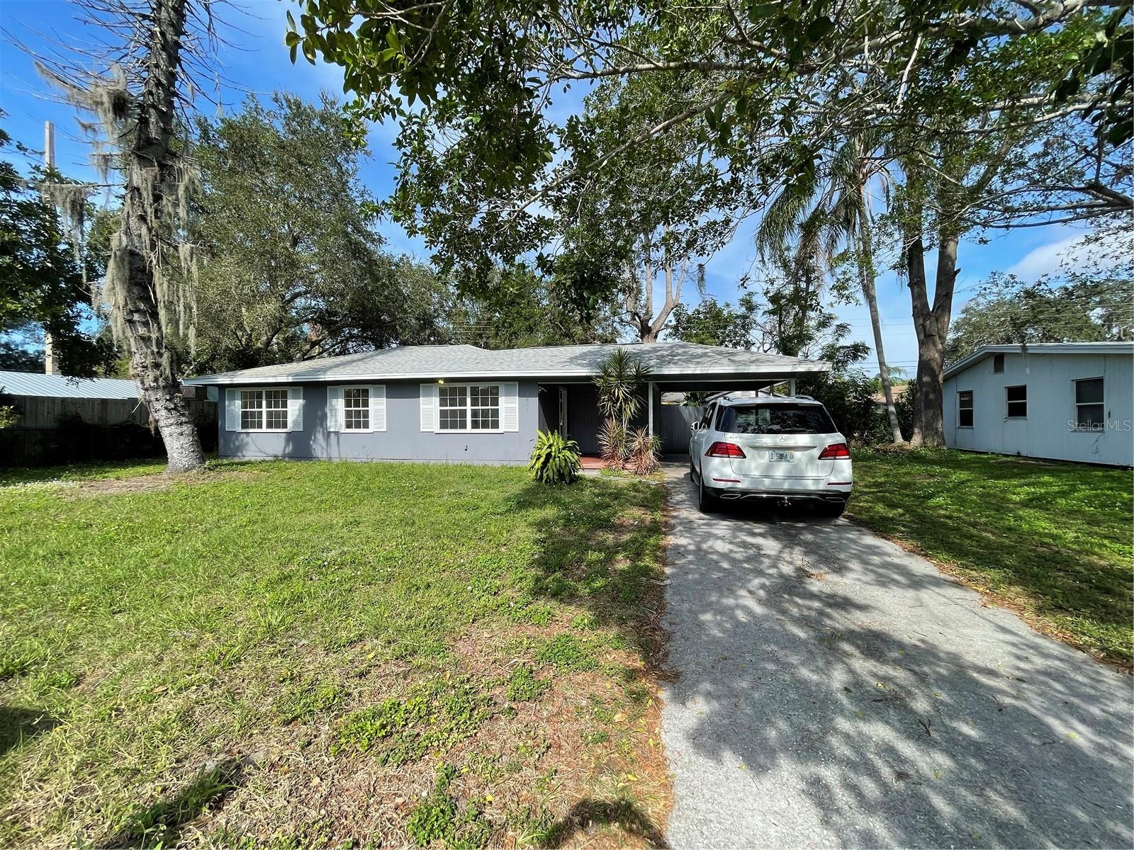 Welcome home to this three bedroom and two remodeled bathrooms home. Kitchen has new appliances, countertops, and lighting. Freshly painted with new luxury vinyl plank flooring, a separate laundry room, and covered carport. This house also comes with a large storage shed for your personal use. Patio for backyard entertaining in your own private fenced area. This house is in pristine condition so bring your most selective customers to see this mid century "modern" home.