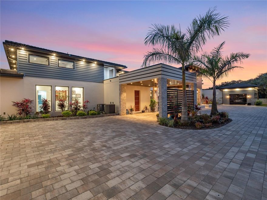 EXPERIENCE THIS PRIVATE CONTEMPORARY ESTATE offering over 7,000 SF of high-quality finishes and state of the art energy efficient construction. Situated on over an acre behind a privacy wall and gated entrance, this home is exceptionally built and offers loads of light with floor to ceiling Anderson Low-E thermal tinted windows and doors, solid poured block wall construction, concrete tile, contemporary metal roofing, whole home solar energy panels, Lutron digital lighting, whole house audio, natural gas, well irrigation and more. The main home features a 5-car garage, 4 bedrooms, 4 full baths and 2 half baths plus a home theatre with acoustic soundproof walls and panels. The estate also features a private 1 bedroom / 1 bathroom casita complete with a full kitchen, walk-in closet, and private bath.  Enjoy your morning workout or yoga indoors while taking in the beauty of the outdoors in the glass walled home gym. For those who cook the open and expansive kitchen is a dream. It features Viking cooking appliances, Sub-Zero refrigerator and freezer, quartz countertops, a large island, prep sink, and beverage refrigerator. The spacious master bedroom offers gorgeous built-in features, engineered hardwood floors and automated window treatments. The spectacular master bathroom features a Zen spa shower with floating soaking tub, steam bath, large walk-in glass shower and exterior garden shower. You will feel like you are on vacation while entertaining outdoors in your resort style pool & cabana complete with summer kitchen. The tranquil sound of your private water wall with a backdrop of 2 large gas fire bowls will set the scene of your gorgeous private oasis...View our 3D Matterport tour link or schedule your private tour today to view this unique modern offering.