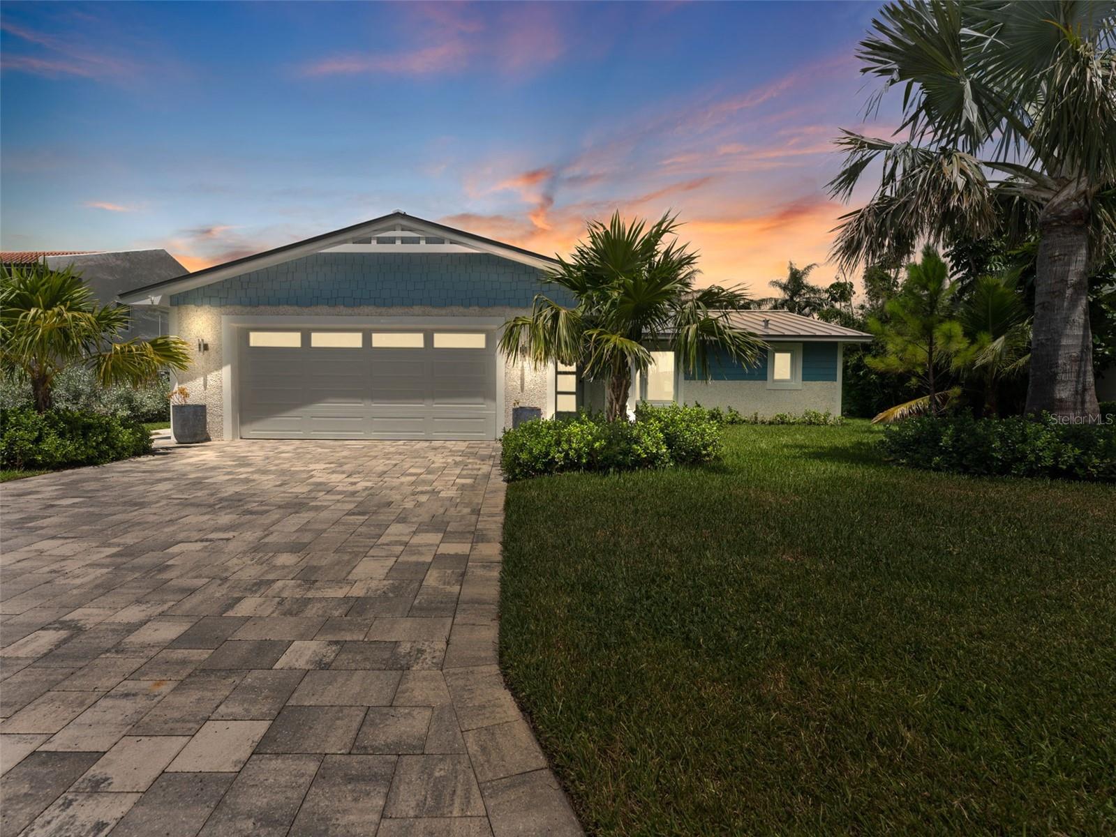 Welcome to your slice of paradise in one of St. Pete Beach’s most desirable neighborhoods—Bahia Shores. Perfectly positioned on a sought-after street, this fully updated home blends relaxed coastal living with sophisticated mid-century style. Wether you're looking for a primary home or a monthly/seasonal rental, this one is for you! Inside, sunlight pours through impact-rated, energy-efficient windows, highlighting an open-concept layout with elegant terrazzo floors and designer finishes. The heart of the home is the chef’s kitchen, complete with quartz countertops, custom cabinetry, and premium stainless steel appliances—ideal for hosting gatherings. Professionally remodeled by a published interior designer and contractor featured in Florida Design and Architectural Digest, this split-bedroom floor plan offers both privacy and comfort. The spacious primary suite feels like a spa retreat with a luxe ensuite bath featuring a Toto bidet, Kohler fixtures, and linen-weave porcelain tile. The guest bath matches the level of refinement with Calacatta Gold tile, another Toto bidet, and Kohler fixtures. A versatile third bedroom connects to the main living area, making it perfect for an office or bonus room. Additional highlights include a new standing seam metal roof for peace of mind, a large two-car garage with fresh epoxy flooring (plenty of room for your vehicles, golf cart, and more), and significant insurance savings thanks to the home’s energy-efficient upgrades. Step outside to a tropical backyard oasis, complete with lush landscaping, a covered paver patio, and plenty of space for barbecues or quiet evenings under the stars. Best of all, you’re just a short stroll to St. Pete Beach’s powdery sand, charming local shops, and award-winning restaurants. This is more than a home—it’s a lifestyle. Schedule your private showing today and see why Bahia Shores is one of the Gulf Coast’s most coveted communities.