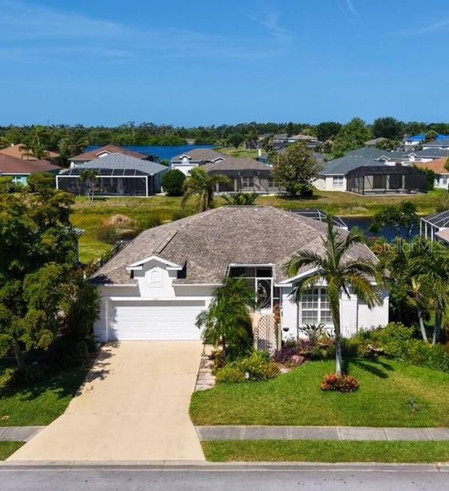 Feel right at home in this well maintained, freshly painted, single-story thoughtfully landscaped, 3 bedroom 2 bath pool home with lovely water views. Located in the desirable Glenn Lakes community, just minutes from IMG Academy, Detwiler's Farm Market, and the Gulf Coast's finest beaches including Anna Maria Island. Step inside to an inviting open living room ideal for gatherings with family and friends. Sliding glass doors lead to the lanai, seamlessly extending the living space outdoors, perfect for enjoying the water and pool views, and bringing the outdoors in. Just off the main living area, the kitchen offers a more defined layout featuring granite countertops, a new refrigerator (2023), and a dedicated space for both dining and casual seating. Bright and functional, it's thoughtfully designed for everyday living. A laundry room leads to the two-car garage for added convenience. The split floor plan offers privacy, with the primary suite tucked away on one side of the home and two additional bedrooms (or optional den/office) on the other. Updates include: refreshed lighting, new kitchen faucet, pool cage re-screening, and more. Enjoy relaxing poolside or sipping coffee on your lanai as you take in the peaceful water views and vibrant sunset skies. Glenn Lakes is a well-maintained community featuring a lakeside park and tennis court. Conveniently located near boating, golf, downtown Bradenton & Sarasota, SRQ Airport, area beaches and near to IMG Academy.