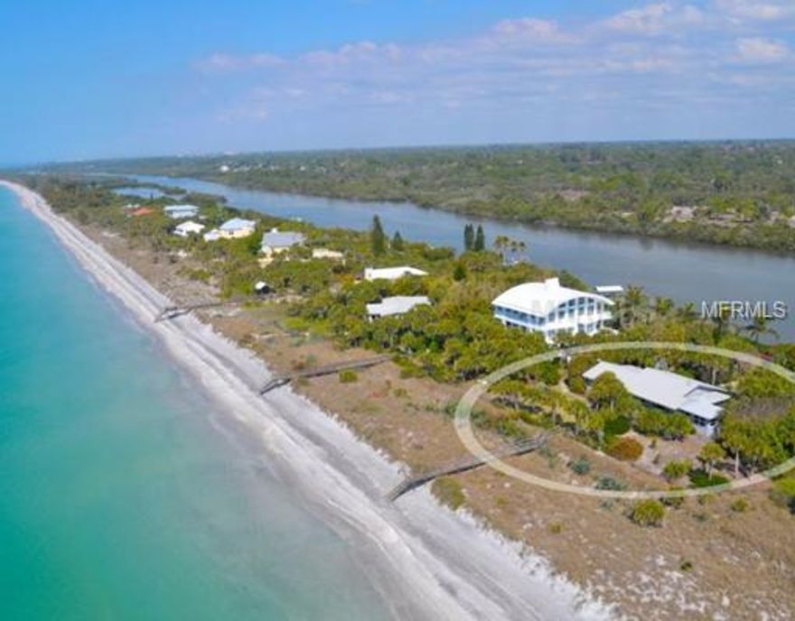 This original 1955 cypress home, in the gated north Manasota Key area on over an acre of gulf-to-bay property, is classically representative of the homes developed here in the 1950s. Charming paneled rooms, beamed ceilings and picture windows that show off the tropical landscaping make this rustic Florida, cottage-style home comfortable for its residents and welcoming to visitors. A raised boardwalk takes you over protected vegetation to the gulf and walkable beachfront. A lighted boat dock on the bay includes a hoist for your boat and easy access to the Intracoastal and Lemon Bay.
