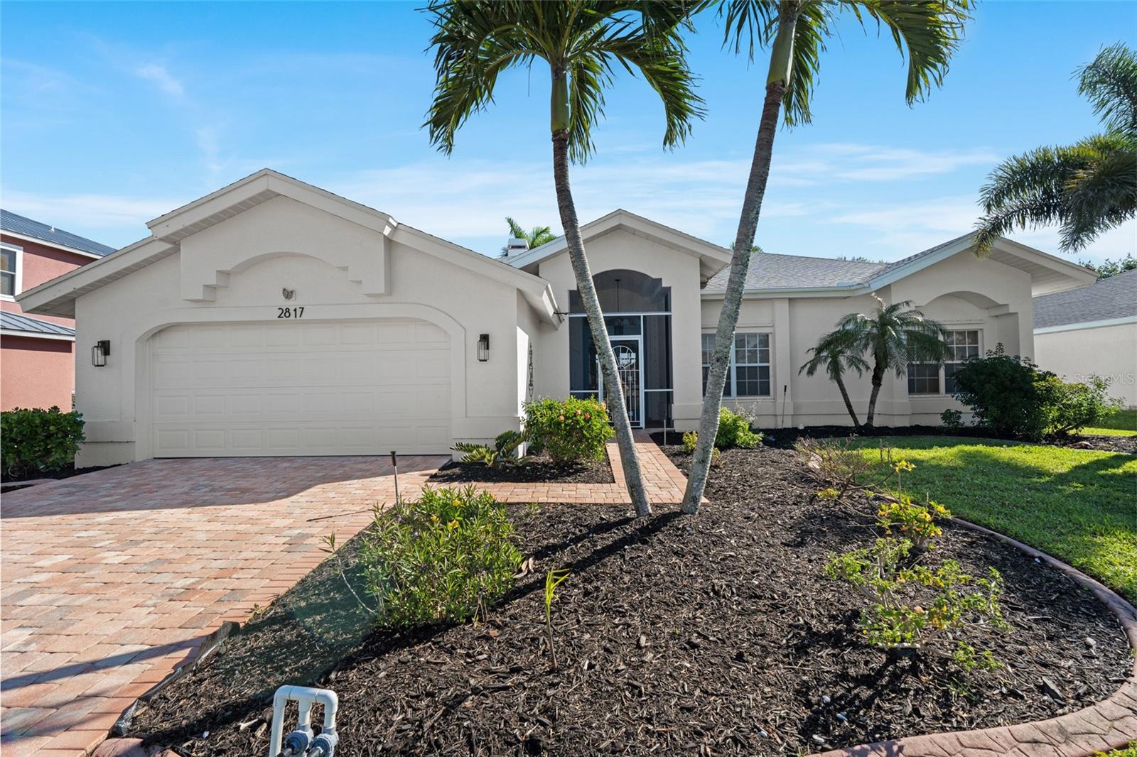 Sailboat Access! Sold FURNISHED, come check out this beautiful Direct Gulf of America Access home in the premier neighborhood off of Surfside Blvd in Southwest Cape Coral. The waterfront experience begins with the view looking through the front French Doors where you can see straight through the home to the 200' canal and the tiki hut on the dock with lift and captains walk. This 3 bedroom, 2 bathroom home has a great layout with split bedrooms and 2 living areas to enjoy. The roof was replaced in 2022 with a 2015 AC and a water heater that's just over 2 years old. Enjoy the miles of bike lanes and sidewalks and the shops and restaurants less than a mile away. Schedule your personal showing today!