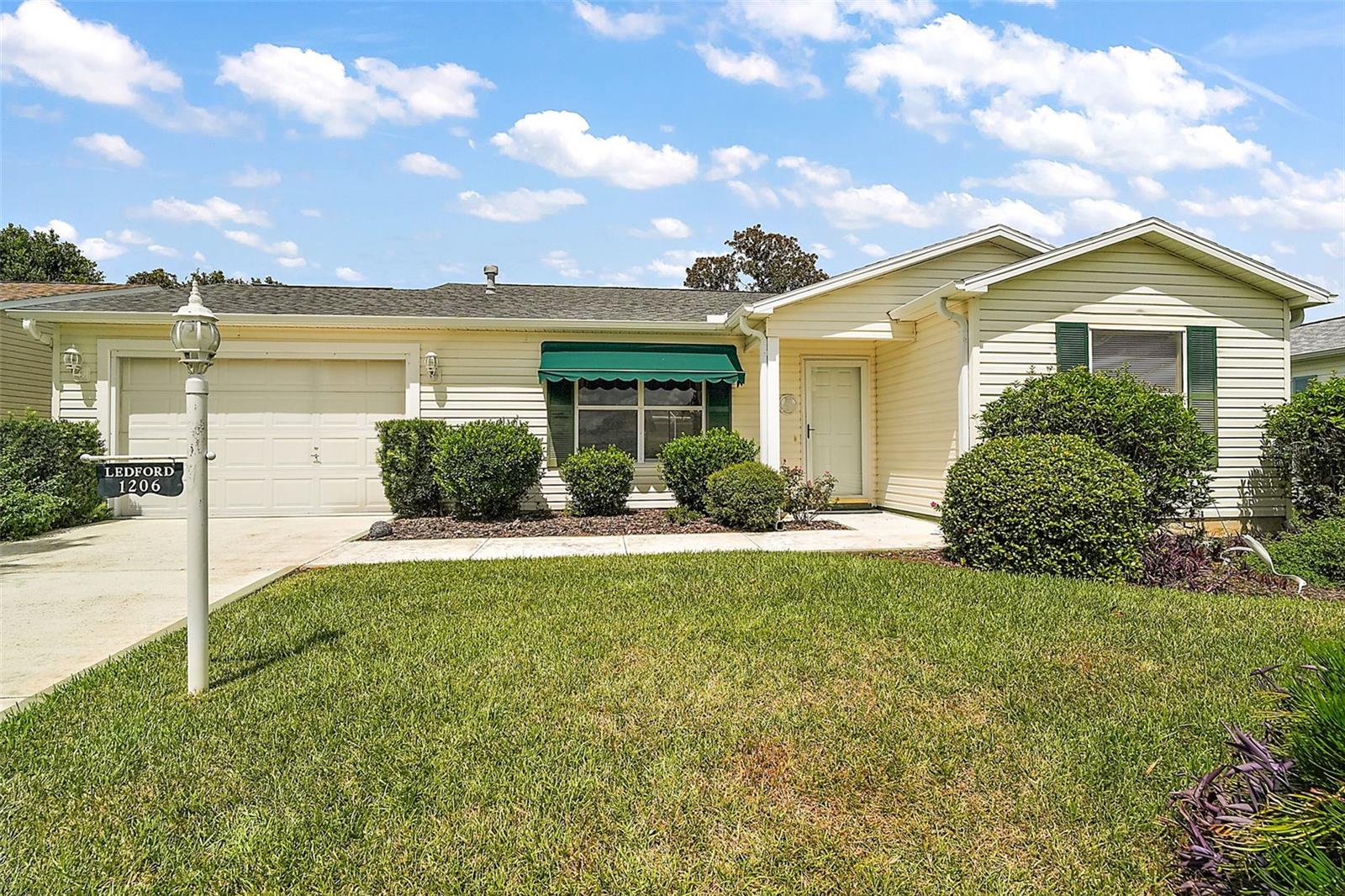 Welcome to this beautiful maintained 2-bedroom, 2 bath Austin model home in the sought-after community of The Villages, NO BOND offering 1,808 sq ft of total sq. footage. As you enter, be greeted by a bright open living and dining area featuring gleaming engineered hardwood flooring in both living and dining room. On the left side of the dining room you will find a spacious kitchen with plenty of cabinet storage, ample counter space, and cozy area for your breakfast nook. Perfect for your morning coffee. The split-bedroom floor plan ensures privacy for you and your guests. The guest bathroom is generously sized, while the primary suite features a sliding glass door to the oversized lanai and a en-suite bathroom with a walk in shower, and a walk in closet. One-car garage with dedicated golf cart parking space for added convenience. This home is minutes away from Spanish Springs and close to Sumter Landing as well. If going to night time events are what you are looking for you are just a short ride to the Savanaha Center or if Golfing is what you are looking for around of golf at the Glenview Country Club is close by You will also be close to shopping, The VA, Medical and Restaurants.