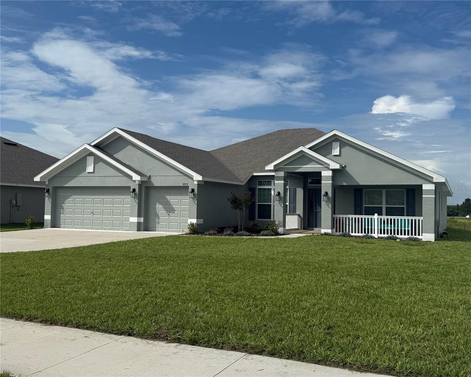 If you are looking for a new home with an amazing location near the Polk Parkway, a cute front porch, a little more land than usual, and a 3-car garage, this 4-bedroom, 3 full bath, beauty could be the answer you have been looking for. The first thing you will notice is that you have space, inside and out. Also, there will never be rear neighbors and the pond view is very peaceful. The cozy front porch is amazing on a cool winter morning, as is the covered rear lanai - perfect for cookouts and sitting around with friends bragging about your favorite ball team. There is a flex room at the front which could be an at home office, formal living space, or den. The dining room is ideal for dinner parties, and the kitchen breakfast bar, and adjacent dinette are great for quick and casual meals. The great room and open plan layout really make the space feel airy, as do all the windows and glass doors that let in loads of natural light. The bright kitchen is the center of the home and will be great for bakers and cooks with all the available counter space. The master suite is set apart from the other bedrooms in this split floor plan design. It has a large bedroom, two separate walk-in-closets, and the "coup de gras" is the split vanities with separate shower and soaking tub in the main bathroom, heaven. The pool bath is adjacent to two of the bedrooms, has an extra long double vanity, and outdoor access to the lanai. The other secondary bedroom has a next door bathroom room too. There is a laundry room inside with a shelf to place all your supplies. The 3-car garage has a lot of space, plenty for your vehicles and for some storage. This brand new 2025 built Adams home was just purchased, and due to a family emergency the owner must sell now. The washer, dryer and refrigerator do not convey (they just bought them). Please take a look at the pictures. There is a survey on file. If you like what you see, please request a showing immediately. This home is new and below market price. Don't miss out, see it today.