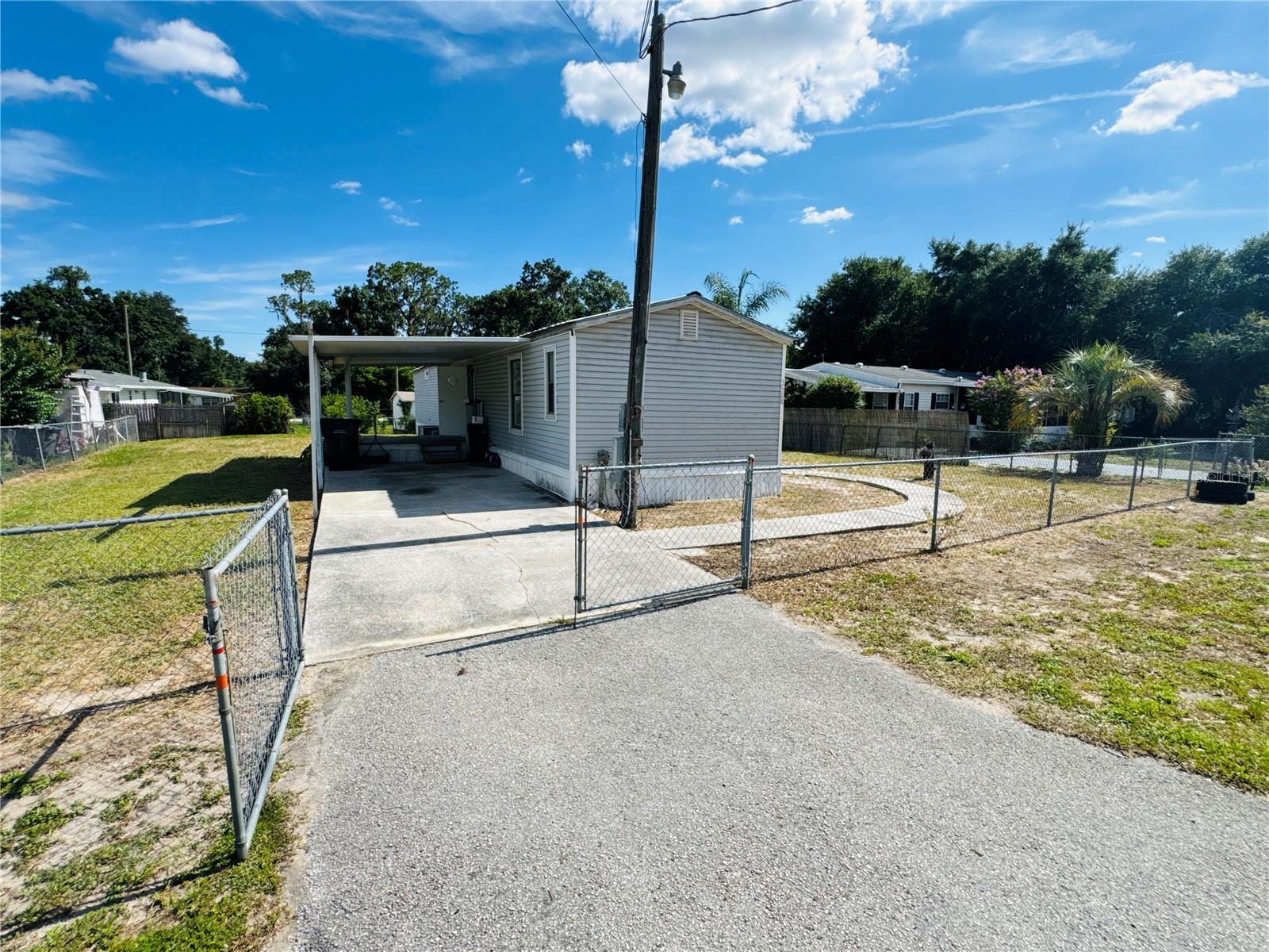 Beautiful 2-Bedroom, 2-Bath Manufactured Home on a Fully Fenced Lot, Perfect for Pets and Added Privacy. This Property is Located Outside of any HOA or CDD, with NO Additional Restrictions. Move-in Ready, Carport with Space for One Vehicle, Indoor Laundry, and Included Appliances. Nearby schools: Sandhill Elementary, McLaughlin Middle School & Fine Arts Academy, Winter Haven Senior High.
Local amenities: Eagle Ridge Mall with Movie Theater, Bowling alley, Retail Stores, and Dining; Florida’s Natural Grove House, and other Attractions Just Minutes Away.
Nature & parks: Lake Kissimmee State Park and Nearby Lakes Provides Plenty of Outdoor Activities. Lake Pierce Boat Ramp, Just 3 Minutes Away, is a Public Ramp Popular for Boating and Fishing (Bass, Bluegill, Blk Crappie), with Access for Launching and Shore Fishing.
Enjoy a Peaceful Location Surrounded by Nature, While Still Being Close to Everything Lake Wales has to provides. Perfect for a Small Family or as a Rental Investment. Don’t Miss This Opportunity!