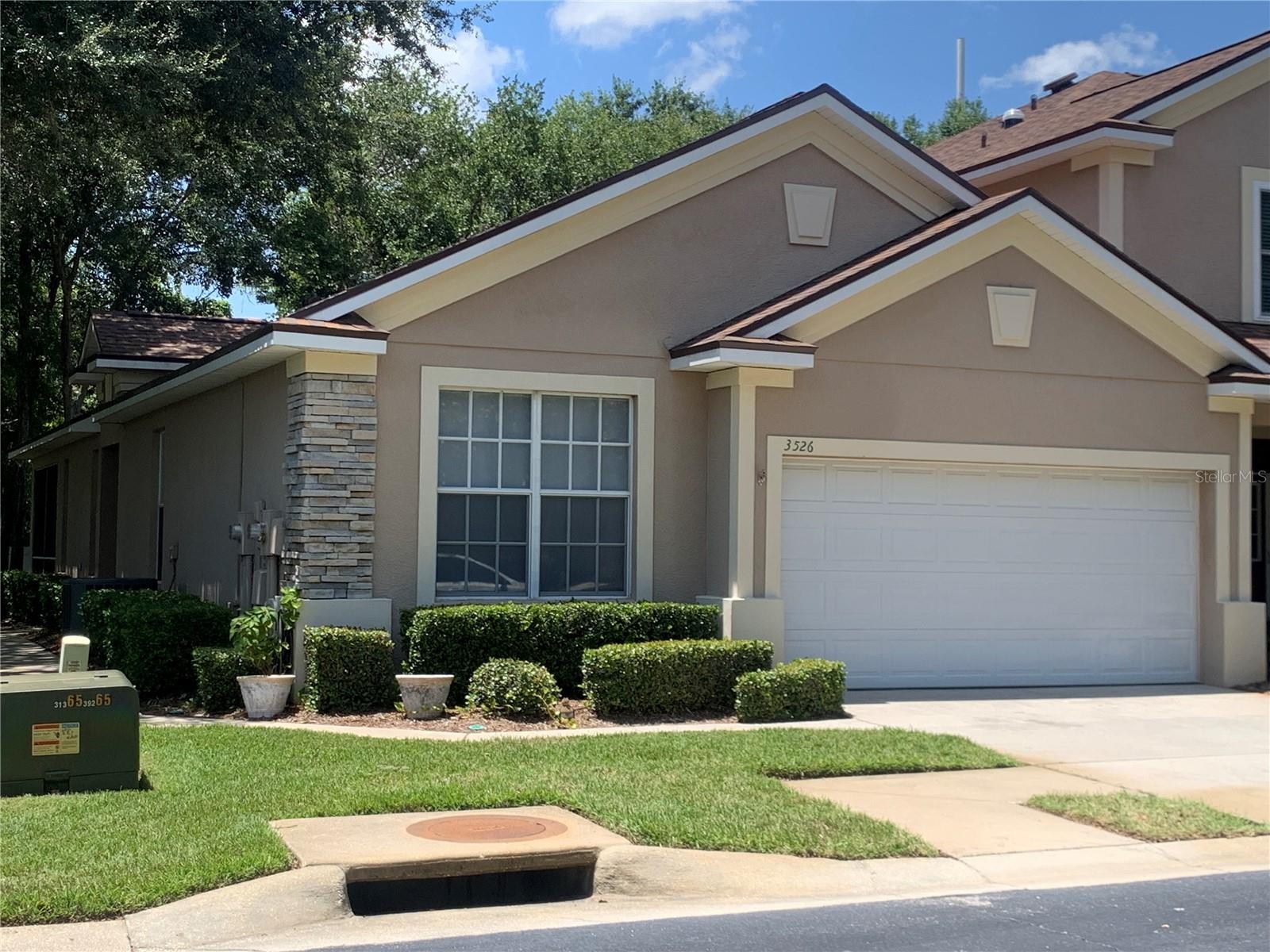 SHOWSTOPPING move-in ready home for lease in the gated Savannah Landings community! This remarkable home is located as an end unit with a two-car garage and well-maintained landscaping! There is a lovely screened and covered lanai in the backyard that leads you to a sizable backyard! This home is conveniently located right next to the community pool and clubhouse so you will have the amazing amenities at your fingertips! Step inside and appreciate the high ceilings, rich wood flooring, and natural light with plantation shutters that begin in the spacious great room! French doors lead you to your private lanai! There is a dining room connecting the great room and kitchen with tray ceiling! Enjoy preparing meals with the family in the remarkable kitchen complete with stone counters, stainless appliances, rich wood cabinets with crown, and a breakfast bar for quick meals! The master retreat is tucked away on one side of the home wood flooring, tray ceiling, ample windows with plantation shutters, huge walk-in closet with custom built-ins, and a beautiful en-suite with dual sinks, walk-in shower, and separate bath! Two additional bedrooms share a second full bath on the other side of the home! Savannah Landings resides in a great location, with quick access to I-75, and near TONS of shopping, and dining! This home is available for lease NOW! What are you waiting for? Apply today!