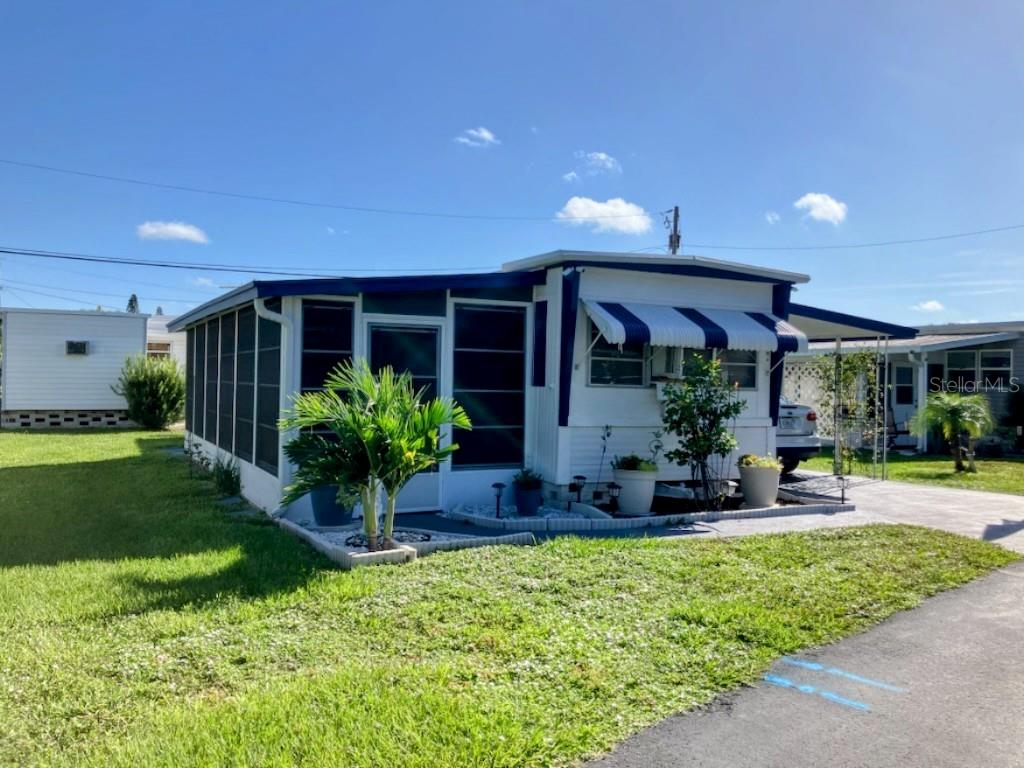 NO LOT RENT!! Land share ownership with low monthly HOA of only $182 in a 55+ community. This mobile home offers true PEACE OF MIND! New roof, new floors, new plumbing, new bathroom- all within the last 3 years! Large screened lanai and beautifully landscaped. And much more! Cash transaction only, no financing.