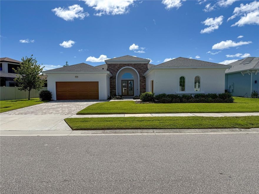 Welcome to 8833 Sanders Tree Loop, an exquisite 3-bedroom, 3-bathroom, 3-car garage home located in the sought-after Epperson community of Wesley Chapel. Built in 2023, this beautifully designed Biscayne Sabal I model sits on a spacious 10,236 sq ft lot and offers over 3,100 sq ft of open living space—perfect for both entertaining and everyday living.    Step inside to discover a thoughtfully crafted layout featuring high ceilings, upgraded tile flooring, and an abundance of natural light. The chef’s kitchen boasts premium cabinetry, a large center island, upgraded lighting, and seamless flow into the expansive living and dining areas. The primary suite is a serene retreat with tray ceilings, walk-in closet, and a luxurious en-suite bath with dual vanities and upgraded finishes.    Additional highlights include a flex room/home office, generously sized guest bedrooms, and a covered lanai—ideal for outdoor relaxation or entertaining. The 3-car garage provides ample storage, and the large lot offers potential for a pool or extended outdoor living space.    Enjoy all the perks of life in Epperson, including access to the 7-acre Crystal Lagoon, golf cart-friendly paths, resort-style amenities, ultra-fast internet, and a vibrant, family-friendly atmosphere. Located just minutes from shopping, dining, and major highways—with downtown Tampa and TPA airport only 35 minutes away—this home truly offers the best of Florida living.    Don’t miss this move-in ready gem in one of Wesley Chapel’s most exciting communities!