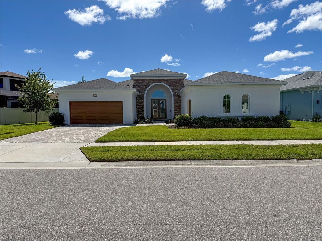 Photo of 8833 Sanders Tree Loop, Wesley Chapel, FL 33545 (MLS # O6353049)