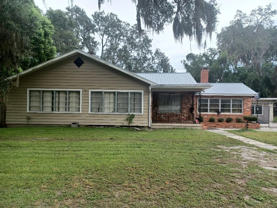 LOCATION, LOCATION, LOCATION! SOOO many possibilities. 3bedrooms plus a possible 4th bedroom/office/den/in-law quarters, 2.5 bathrooms with living room, dining room, family room with fireplace, even a gathering room. Large eat-in kitchen with breakfast bar, indoor laundry room, and lots of storage! Huge in-ground pool in fenced yard, perfect for entertaining. Possible Air B&B, group home, adult day care. Roof is about 8 years old, new central heat and air conditioner about 1 month old. Easy access to restaurants, shopping, churches, hospital, doctors offices, and all the downtown festivities! Don't let this one get away!